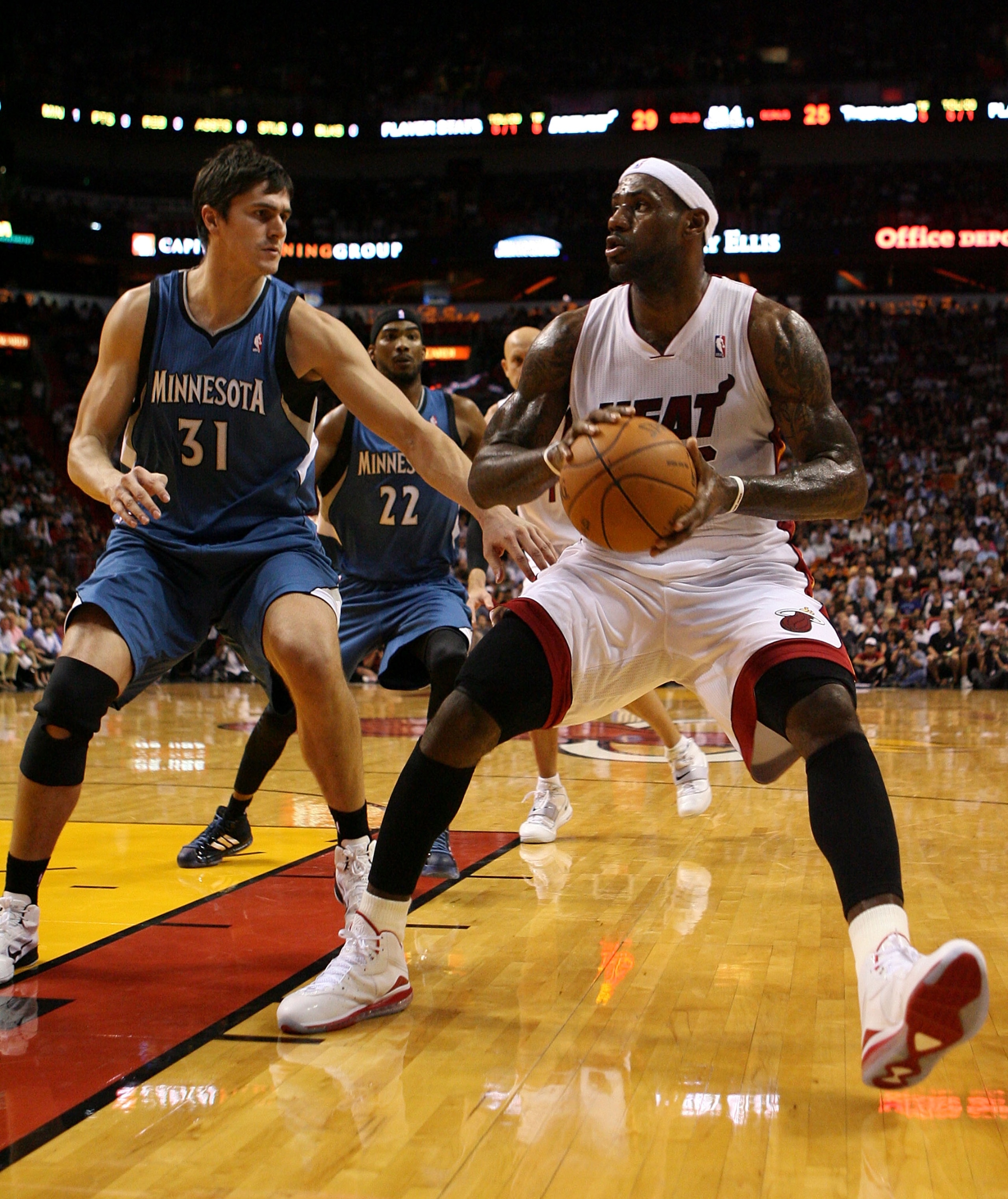 MIAMI - NOVEMBER 02:  Forward LeBron James #6 of the Miami Heat drives around center Darko Milicic #30 of the Minnesota Wolves at American Airlines Arena on November 2, 2010 in Miami, Florida. NOTE TO USER: User expressly acknowledges and agrees that, by
