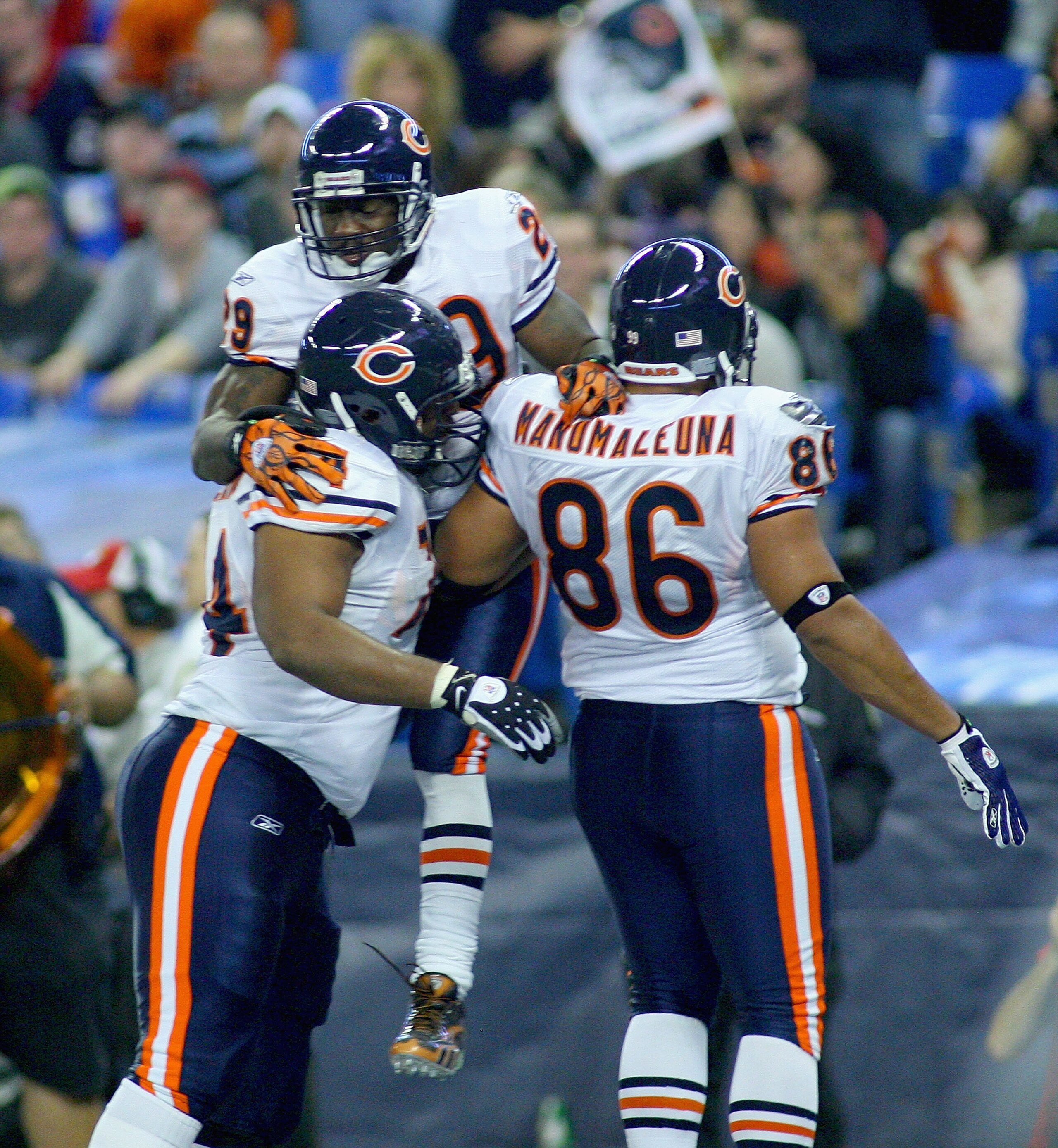 TORONTO, ON - NOVEMBER 07: Chris Williams #74, Chester Taylor #29 and Brandon Manumaleuna #86 of the Chicago Bears celebrate Taylor's touchdown in the third quarter against the Buffalo Bills  at Rogers Centre on November 7, 2010 in Toronto, Canada. Chicag