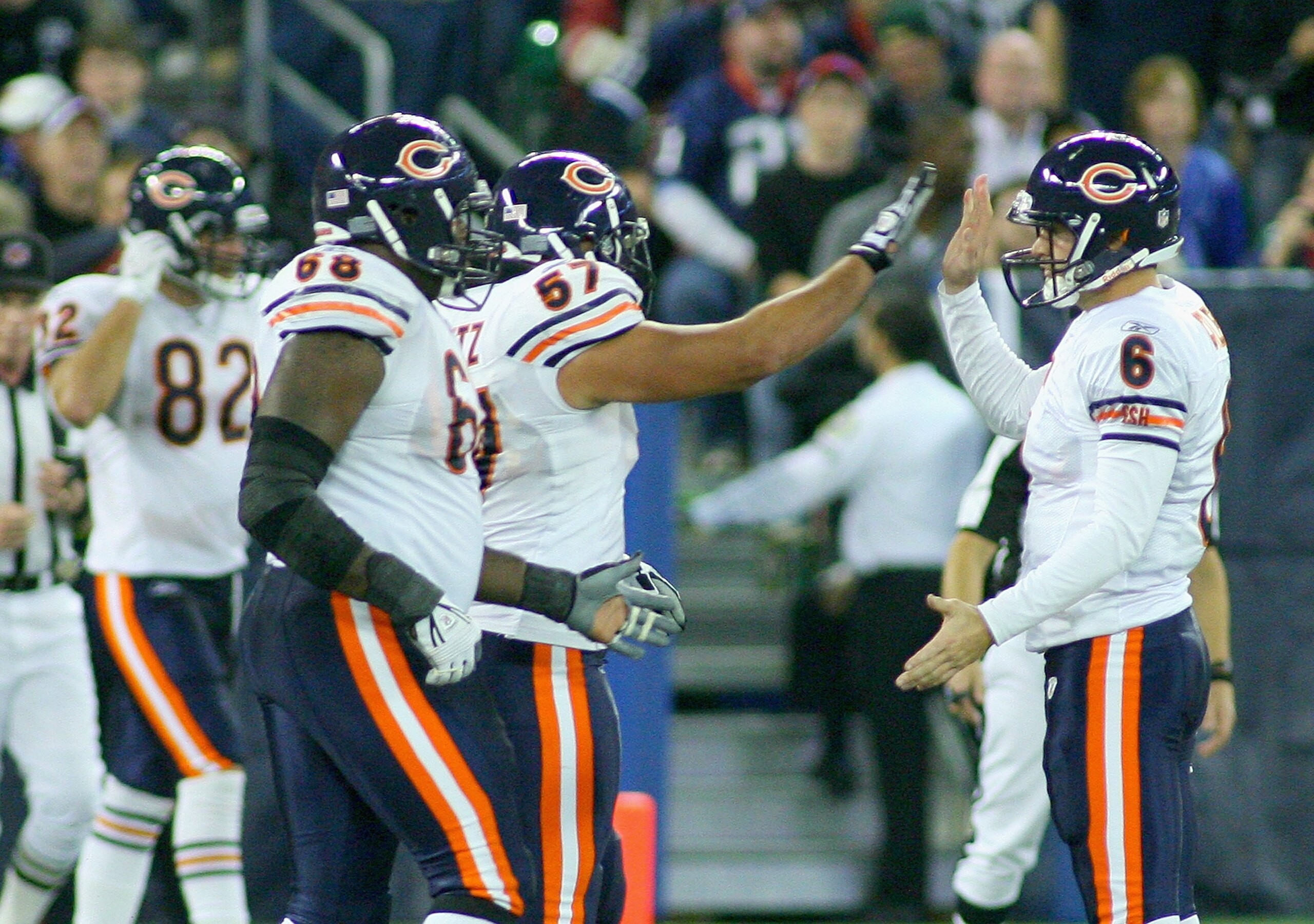 TORONTO, ON - NOVEMBER 07: Jay Cutler #6 and Olin Kreutz #57  of the Chicago Bears celebrate Earl Bennett's game winning touchdown against the Buffalo Bills  at Rogers Centre on November 7, 2010 in Toronto, Canada. Chicago won 22-19. (Photo by Rick Stewar