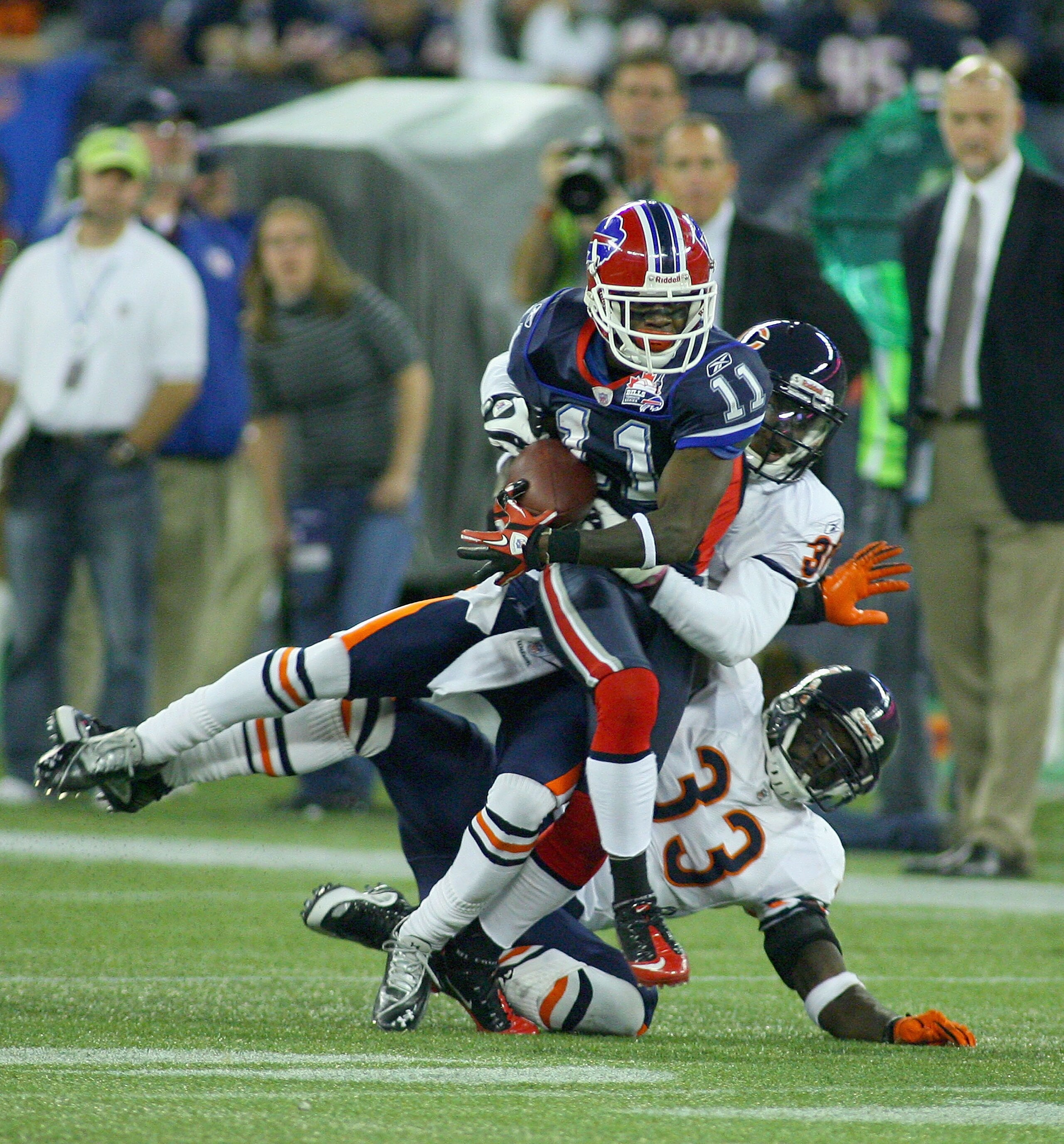 TORONTO, ON - NOVEMBER 07: Roscoe Parrish #11 of the Buffalo Bills is tackled by D.J. Moore #30 and Charles Tillman #33 of the Chicago Bears at Rogers Centre on November 7, 2010 in Toronto, Canada.  Chicago won 22-19. (Photo by Rick Stewart/Getty Images)
