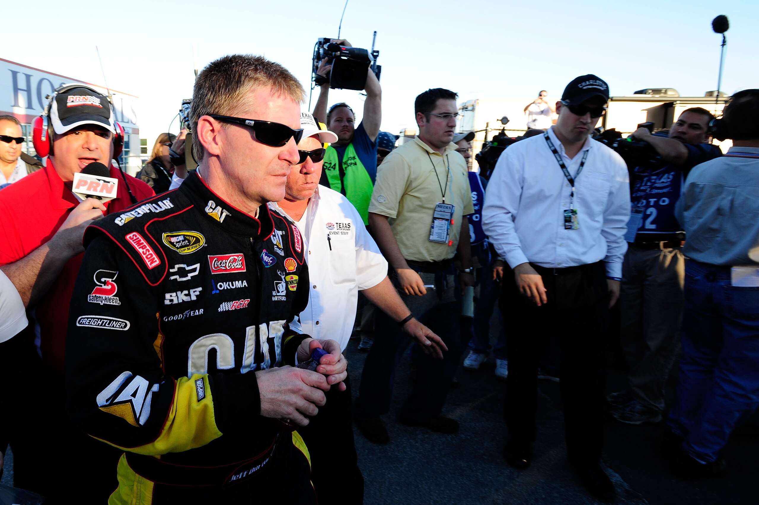 FORT WORTH, TX - NOVEMBER 07: Jeff Burton, driver of the #31 Caterpillar Chevrolett, talks to the media as he walks from the infield care center after an incident with Jeff Gordon in the NASCAR Sprint Cup Series AAA Texas 500 at Texas Motor Speedway on N FORT WORTH, TX - NOVEMBER 07: Jeff Burton, driver of the #31 Caterpillar Chevrolett, talks to the media as he walks from the infield care center after an incident with Jeff Gordon in the NASCAR Sprint Cup Series AAA Texas 500 at Texas Motor Speedway on N
