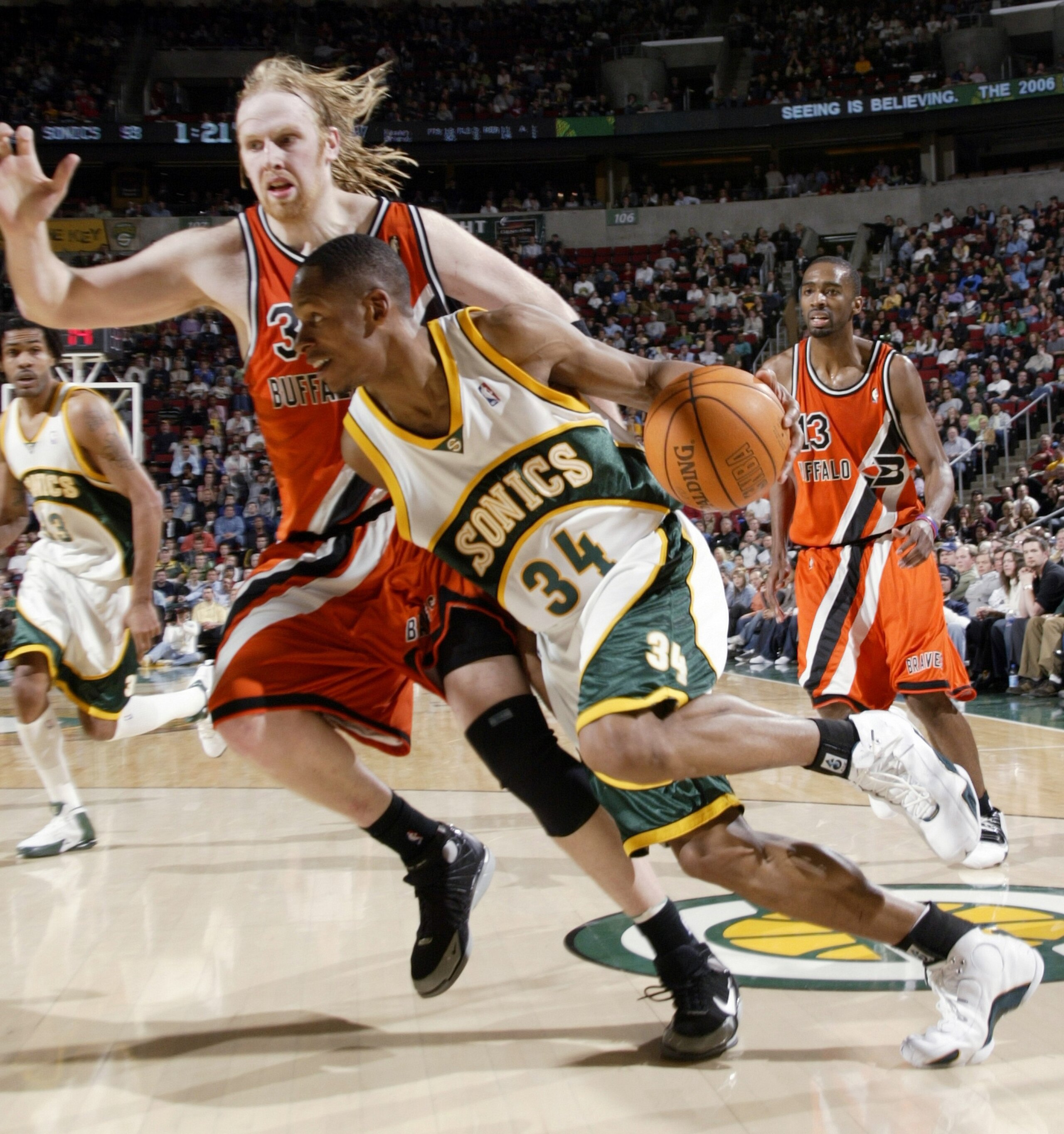 SEATTLE - APRIL 14: Ray Allen #34 of the Seattle SuperSonics drives against Chris Kaman #35 of the Los Angeles Clippers on April 14, 2006 at Key Arena in Seattle, Washington. The Clippers defeated the Sonics 101-97. NOTE TO USER: User expressly acknowle SEATTLE - APRIL 14: Ray Allen #34 of the Seattle SuperSonics drives against Chris Kaman #35 of the Los Angeles Clippers on April 14, 2006 at Key Arena in Seattle, Washington. The Clippers defeated the Sonics 101-97. NOTE TO USER: User expressly acknowle