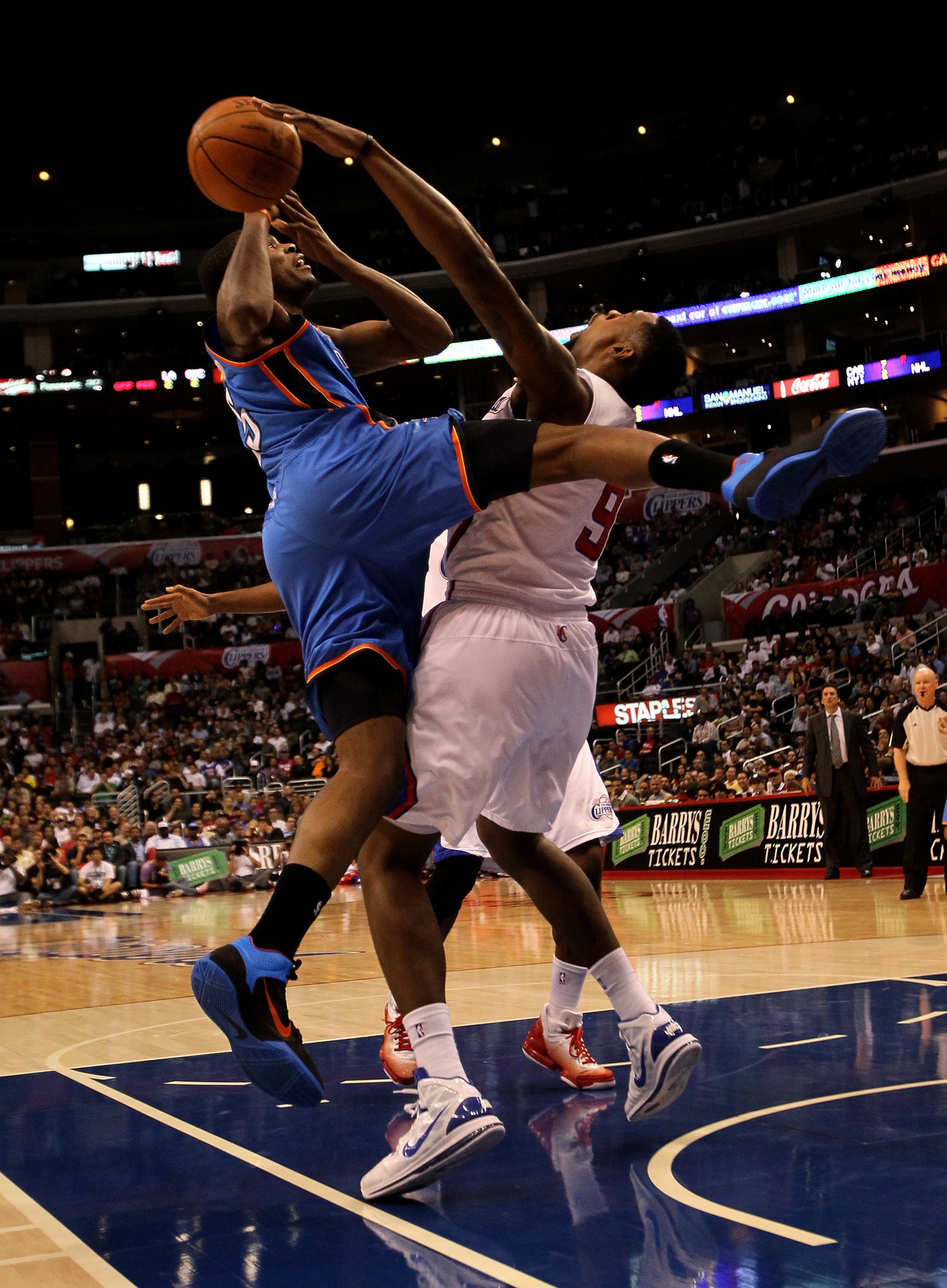 LOS ANGELES - NOVEMBER 3:  Kevin Durant #35 of the Oklahoma City Thunder is fouled by DeAndre Jordan #9 of the Los Angeles Clippers at Staples Center on November 3, 2010 in Los Angeles, California.  NOTE TO USER: User expressly acknowledges and agrees tha