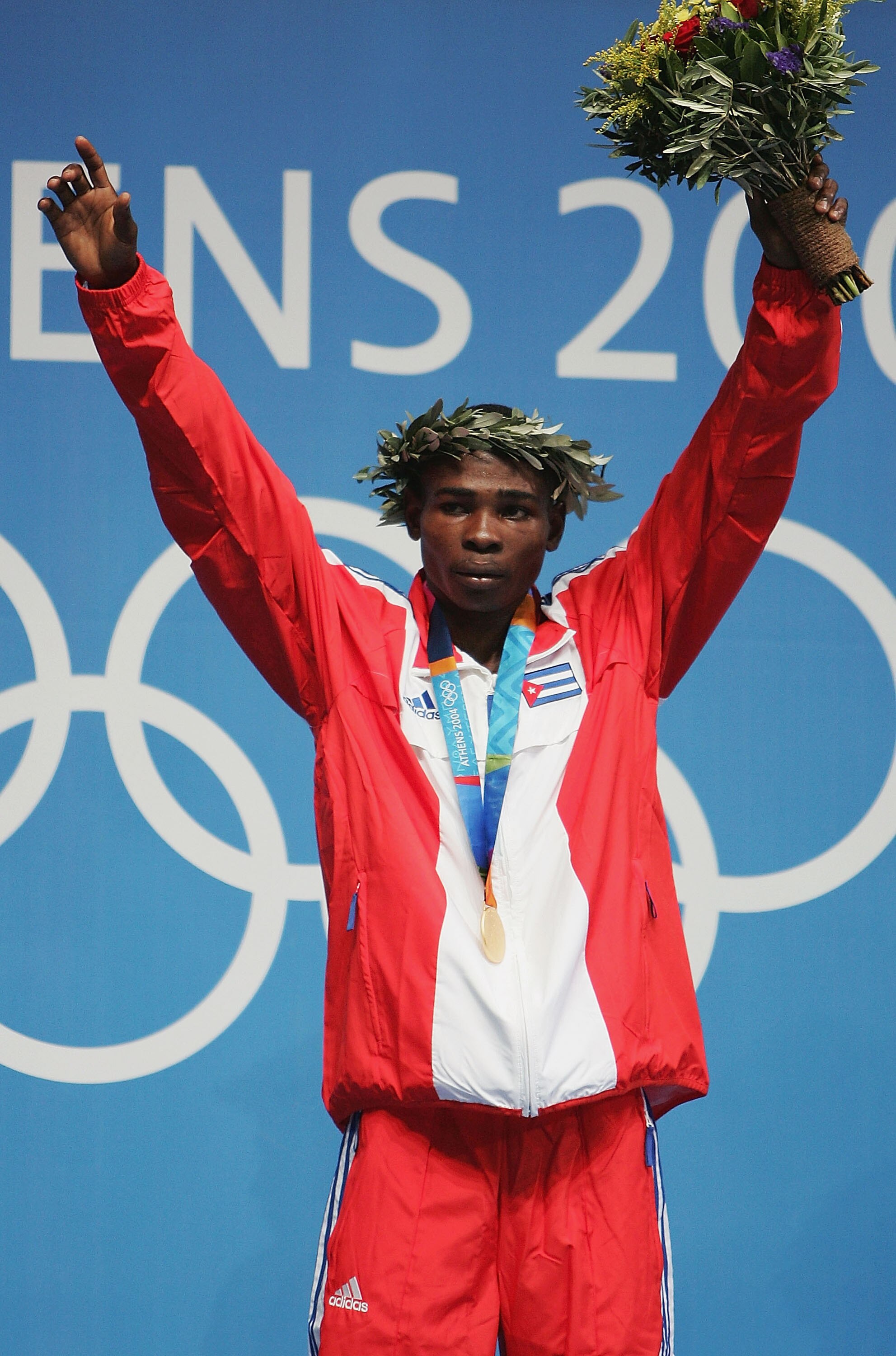 ATHENS - AUGUST 29:  Guillermo Rigondeaux Ortiz of Cuba receives his Gold medal for the men's boxing 54 kg event on August 29, 2004 during the Athens 2004 Summer Olympic Games at Peristeri Olympic Boxing Hall in Athens, Greece. (Photo by Al Bello/Getty Im