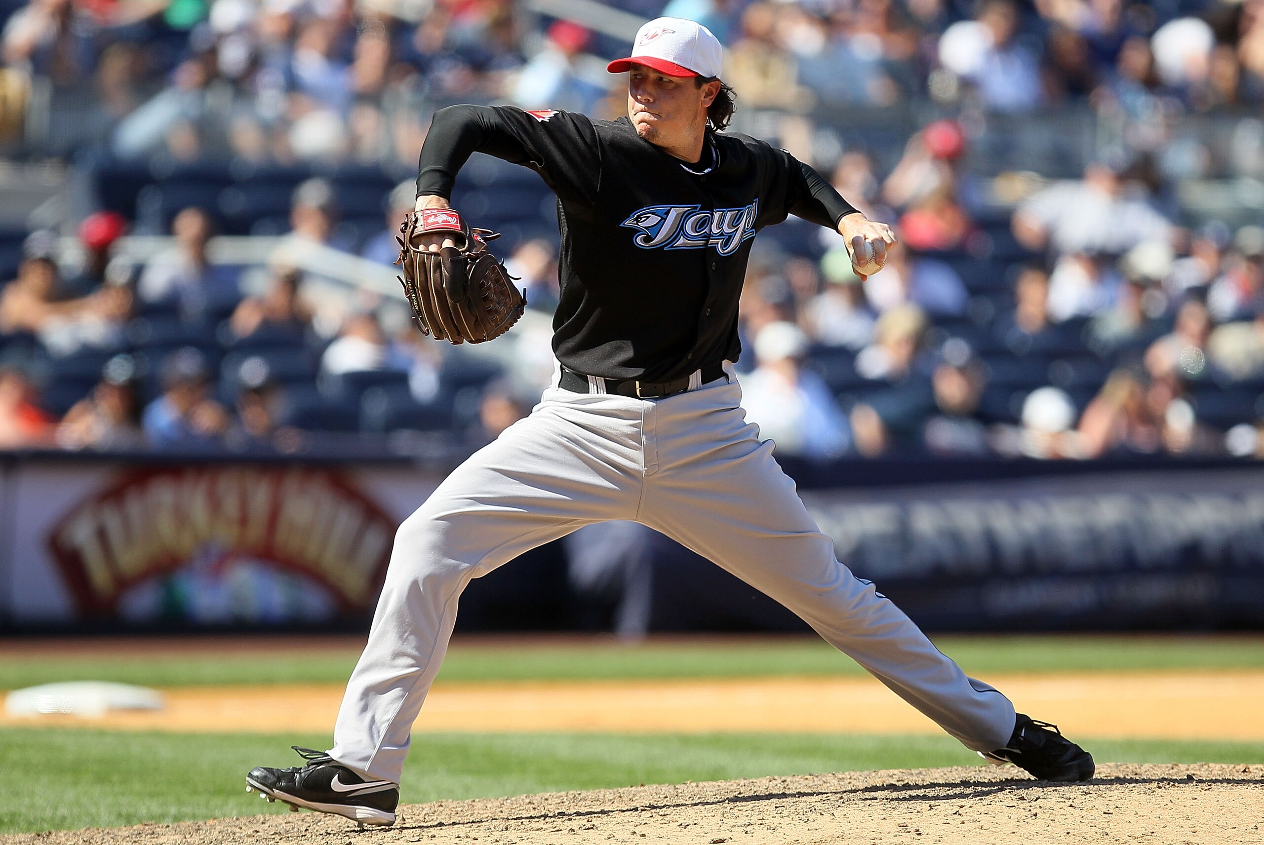 NEW YORK - JULY 04:  Scott Downs #37 of the Toronto Blue Jays delivers a pitch against the New York Yankees on July 4, 2010 at Yankee Stadium in the Bronx borough of New York City.  (Photo by Jim McIsaac/Getty Images)