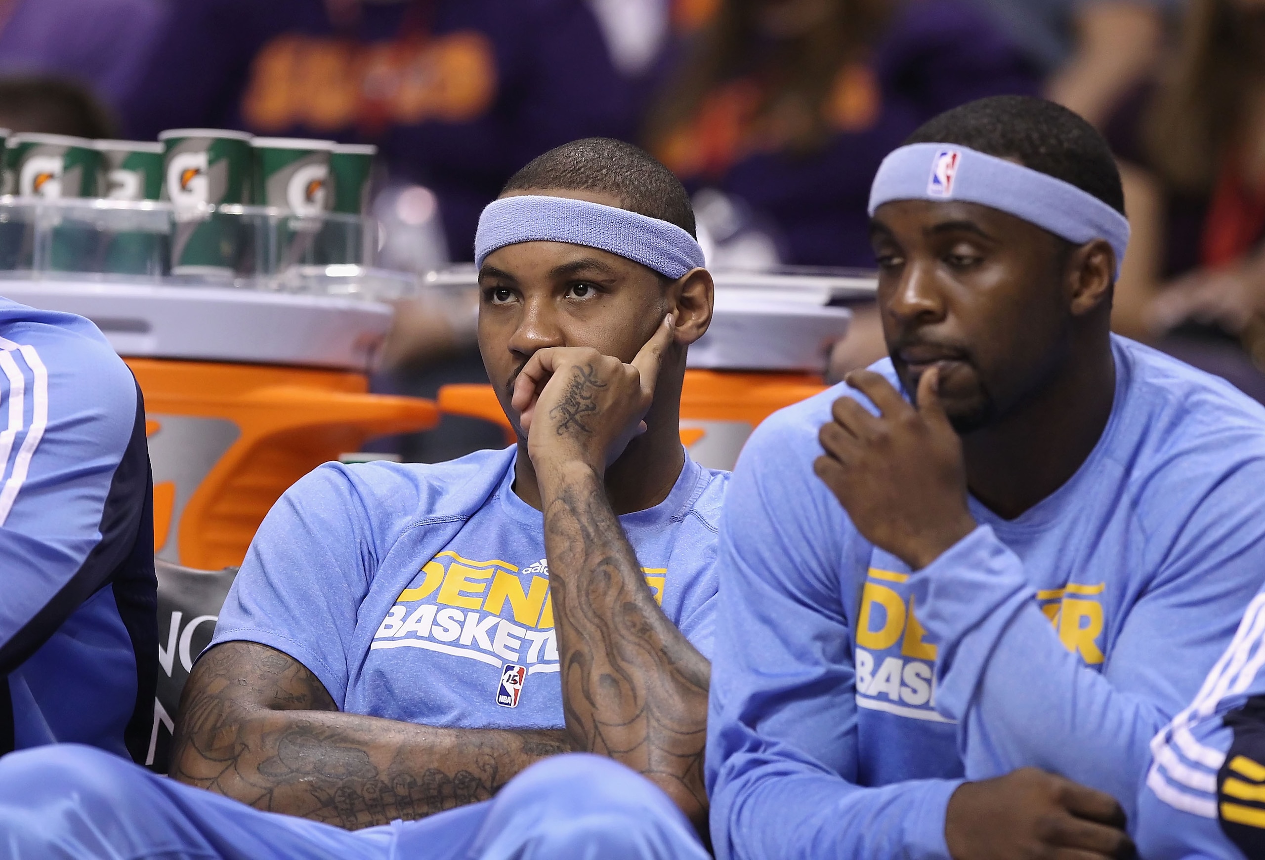PHOENIX - OCTOBER 22:  Carmelo Anthony #15 of the Denver Nuggets watches from the bench during the preseason NBA game against the Phoenix Suns at US Airways Center on October 22, 2010 in Phoenix, Arizona. NOTE TO USER: User expressly acknowledges and agre