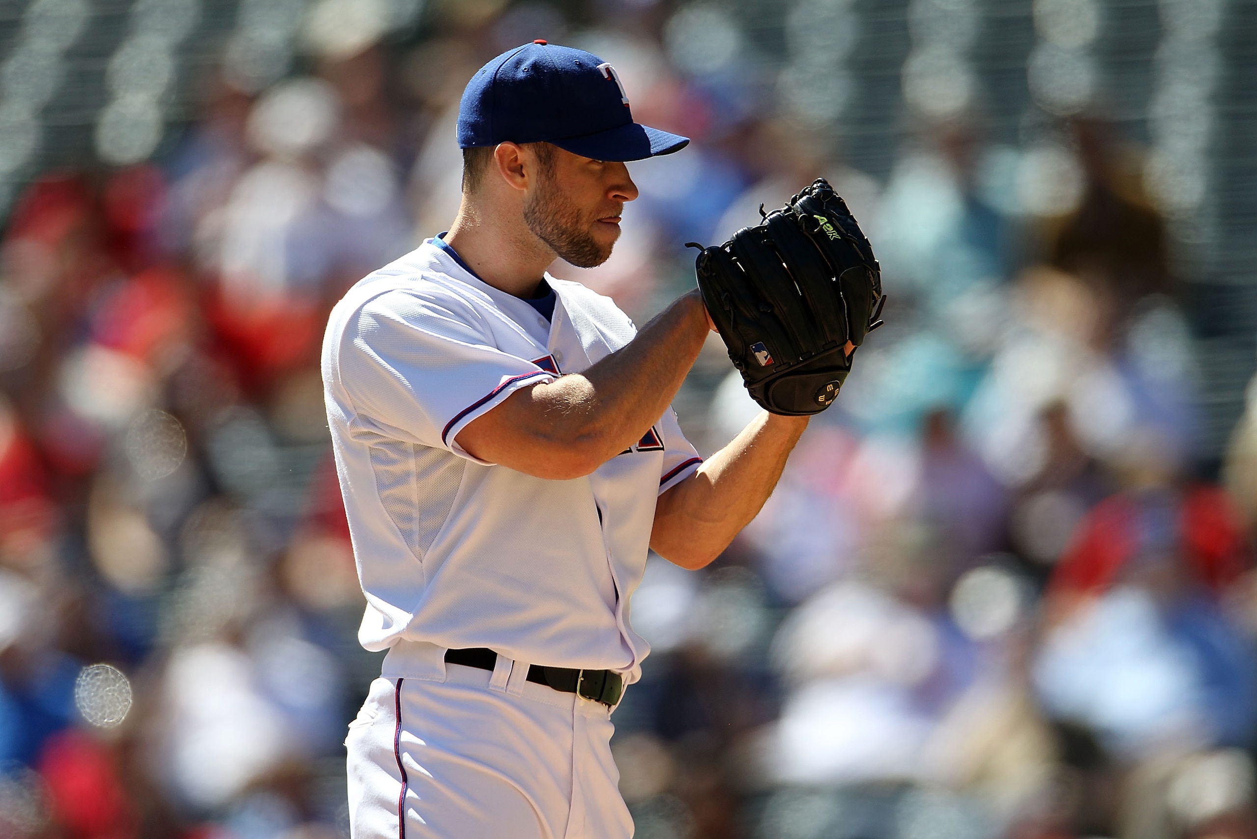 ARLINGTON, TX - SEPTEMBER 29:  Pitcher Rich Harden #40 of the Texas Rangers throws against the Seattle Mariners at Rangers Ballpark in Arlington on September 29, 2010 in Arlington, Texas.  (Photo by Ronald Martinez/Getty Images)