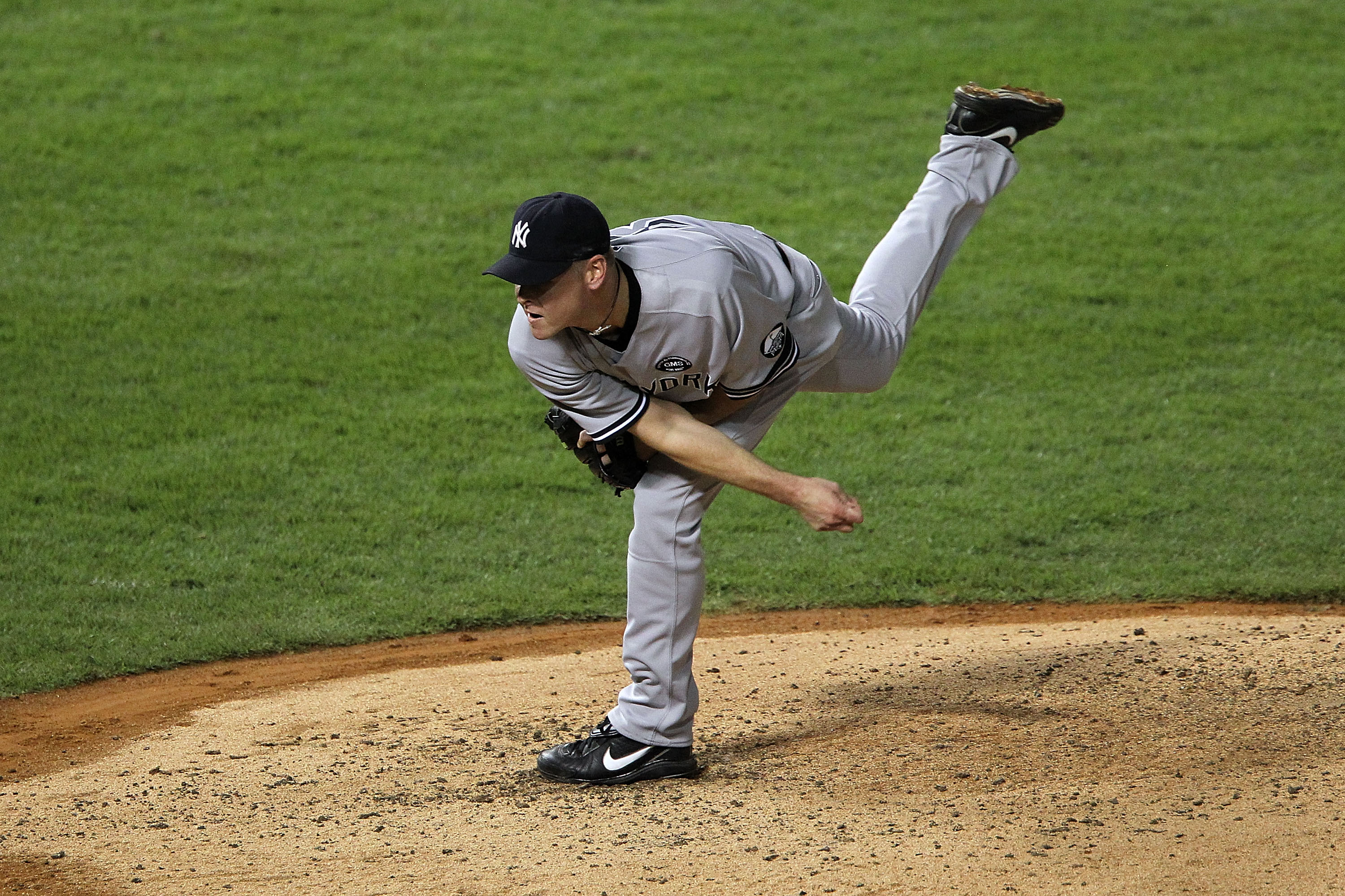 ARLINGTON, TX - OCTOBER 22:  Kerry Wood #39 of the New York Yankees throws a pitch against the Texas Rangers in Game Six of the ALCS during the 2010 MLB Playoffs at Rangers Ballpark in Arlington on October 22, 2010 in Arlington, Texas.  (Photo by Ronald M
