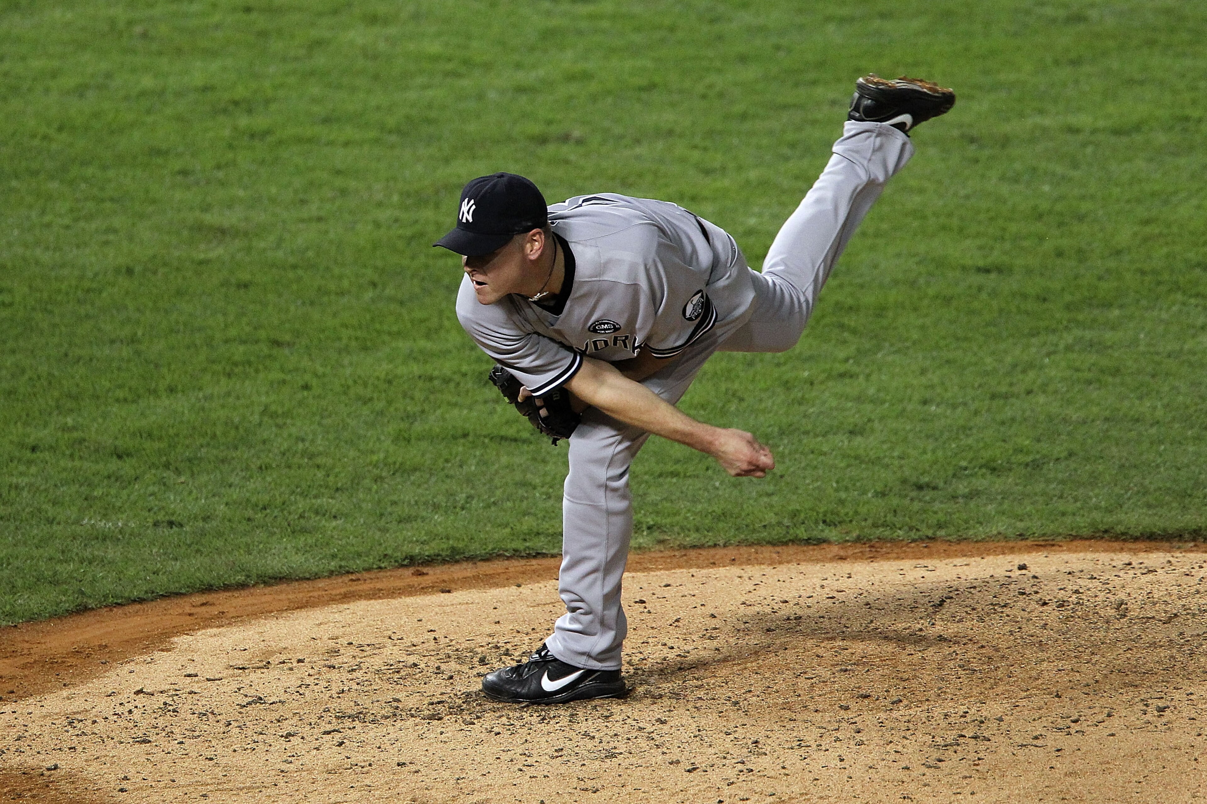 ARLINGTON, TX - OCTOBER 22:  Kerry Wood #39 of the New York Yankees throws a pitch against the Texas Rangers in Game Six of the ALCS during the 2010 MLB Playoffs at Rangers Ballpark in Arlington on October 22, 2010 in Arlington, Texas.  (Photo by Ronald M