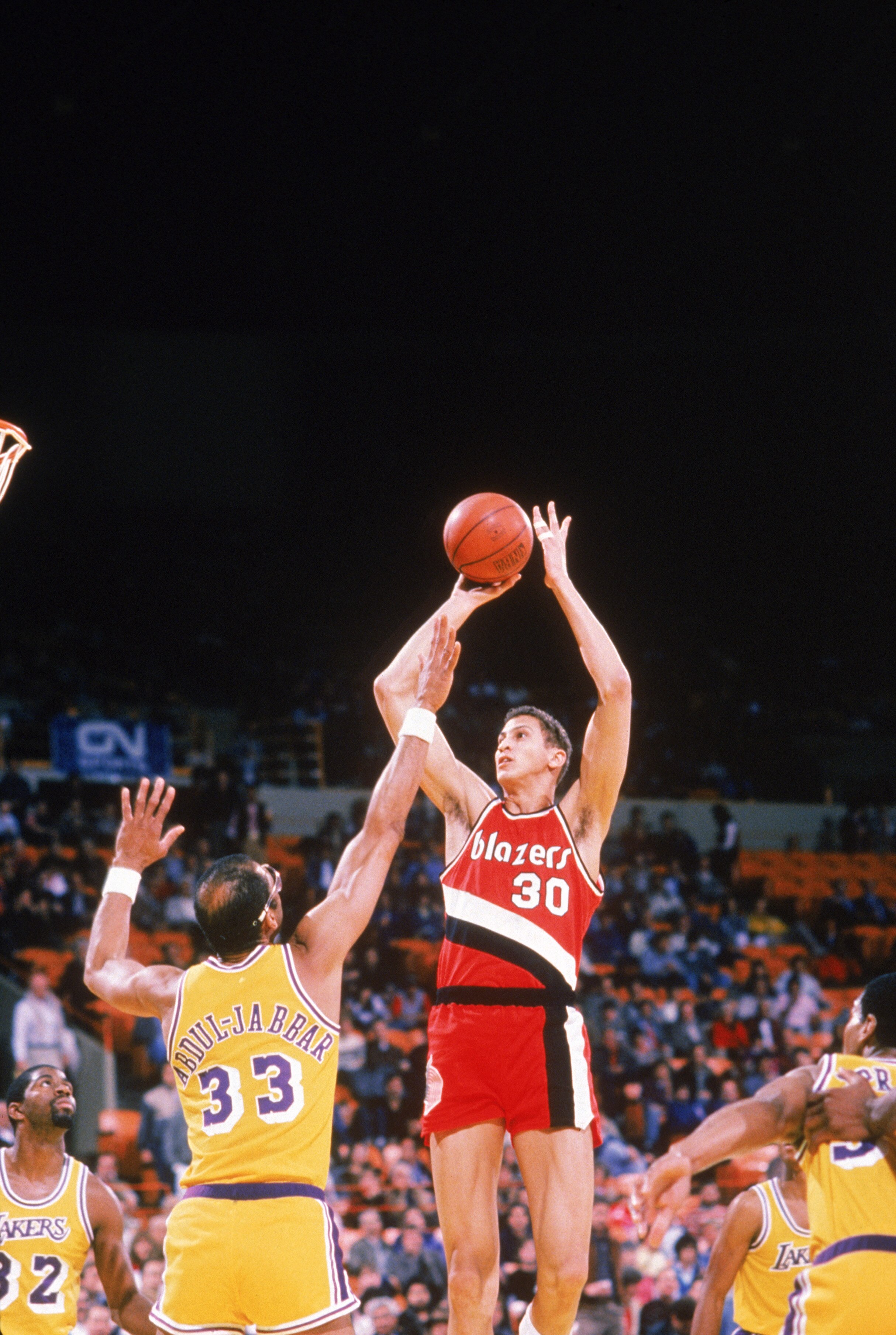 INGLEWOOD, CA - UNDATED:  Sam Bowie #30 of the Portland Trail Blazers shoots over Kareem Abdul-Jabbar #33 of the Los Angeles Lakers during a game circa 1984-1988 at the Great Western Forum in Inglewood, California.  (Photo by Rick Stewart/Getty Images)