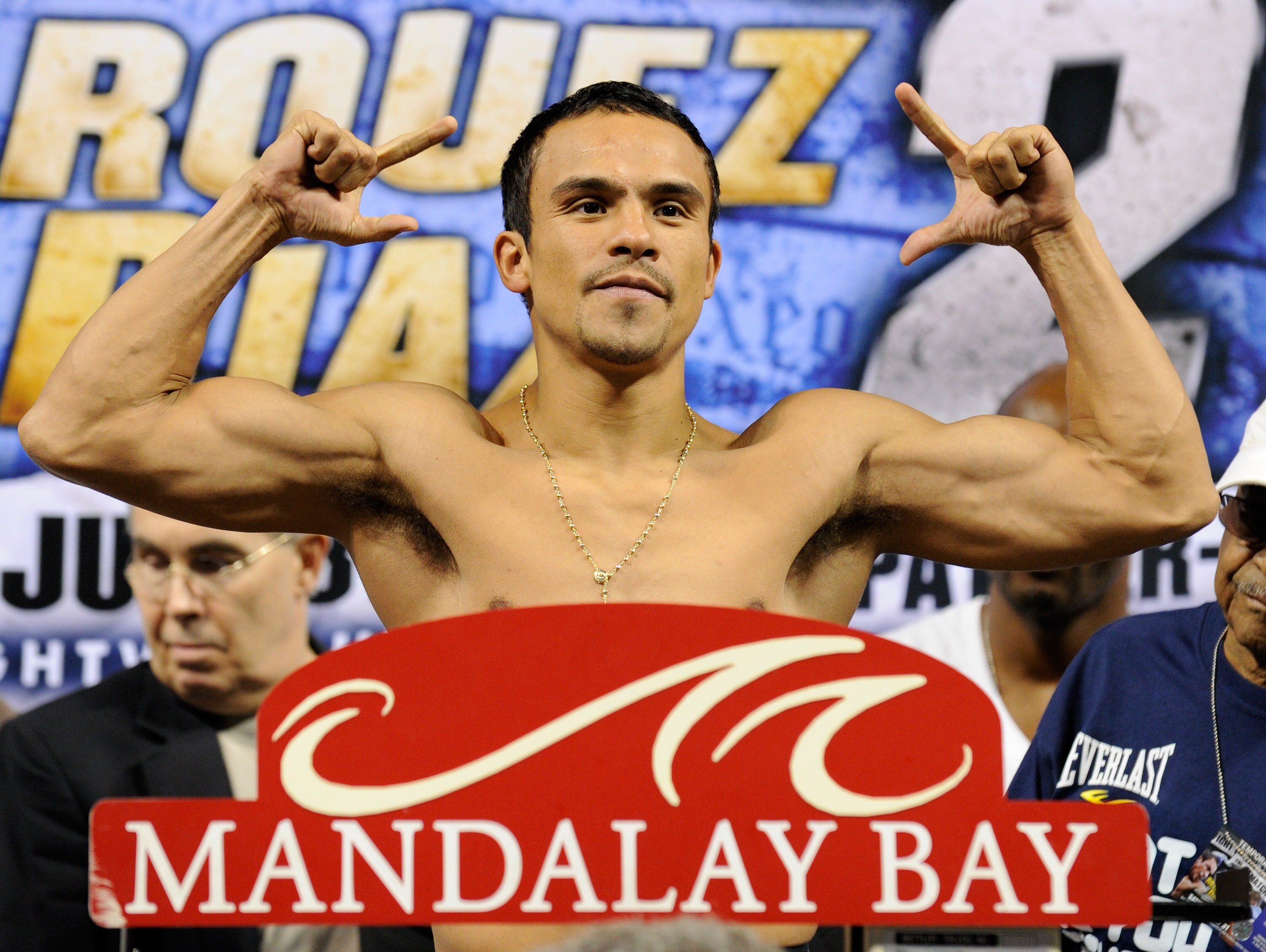 LAS VEGAS - JULY 30:  WBA/WBO lightweight champion Juan Manuel Marquez poses on the scale during the official weigh-in for his fight against Juan Diaz at the Mandalay Bay Events Center July 30, 2010 in Las Vegas, Nevada. Marquez will defend his titles aga