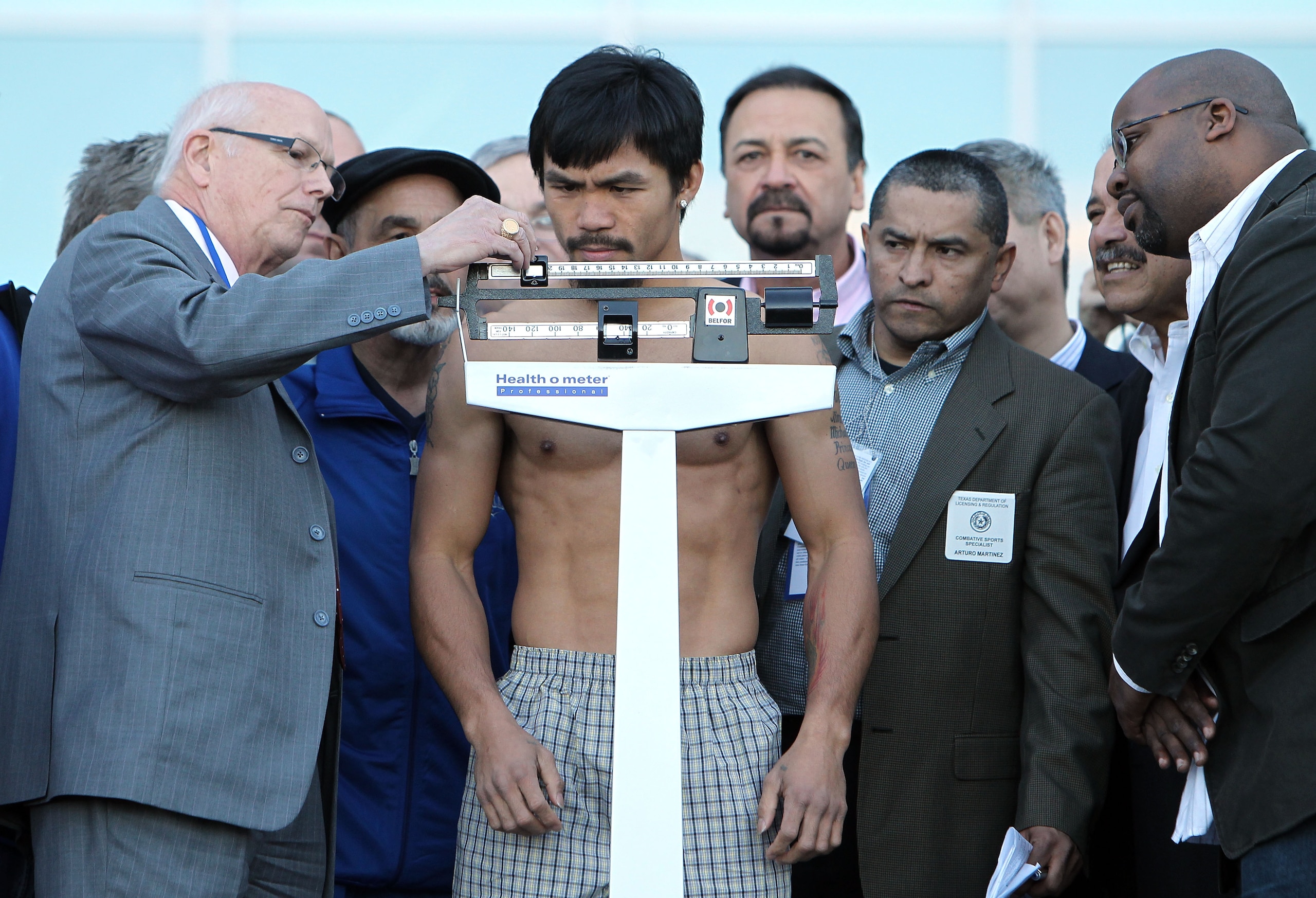 ARLINGTON, TX - MARCH 12: Manny Pacquiao of the Philippines steps on the scale during the weigh-in for his WBO welterweight title fight against Joshua Clottey of Ghana outside Cowboys Stadium on March 12, 2010 in Arlington, Texas. Pacquiao and Clottey wi ARLINGTON, TX - MARCH 12: Manny Pacquiao of the Philippines steps on the scale during the weigh-in for his WBO welterweight title fight against Joshua Clottey of Ghana outside Cowboys Stadium on March 12, 2010 in Arlington, Texas. Pacquiao and Clottey wi