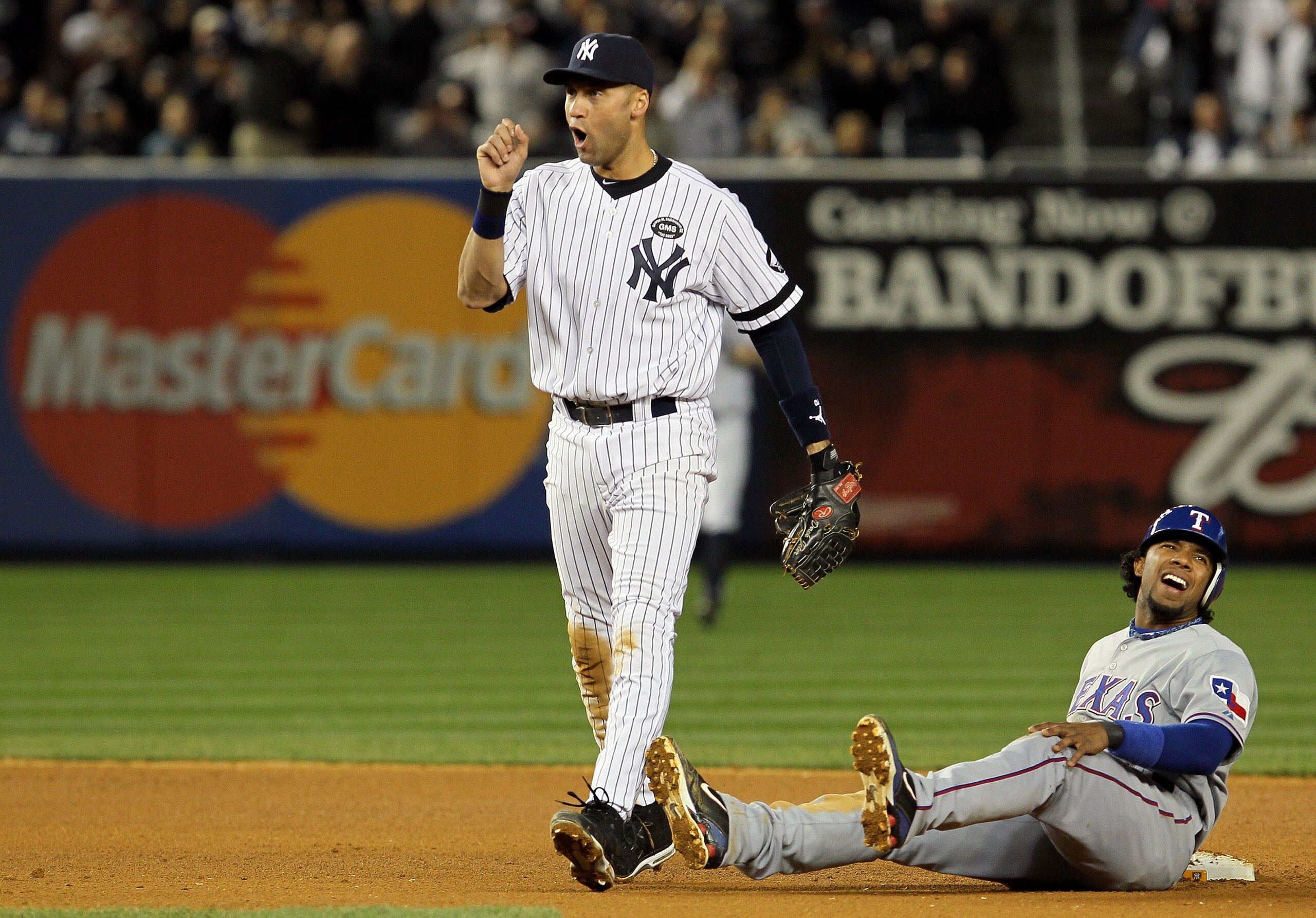 NEW YORK - OCTOBER 20: Derek Jeter #2 of the New York Yankees reacts after he tagged out Elvis Andrus #1 of the Texas Rangers on a pickoff play at second base in the top of the seventh inninng of Game Five of the ALCS during the 2010 MLB Playoffs at Yank NEW YORK - OCTOBER 20: Derek Jeter #2 of the New York Yankees reacts after he tagged out Elvis Andrus #1 of the Texas Rangers on a pickoff play at second base in the top of the seventh inninng of Game Five of the ALCS during the 2010 MLB Playoffs at Yank