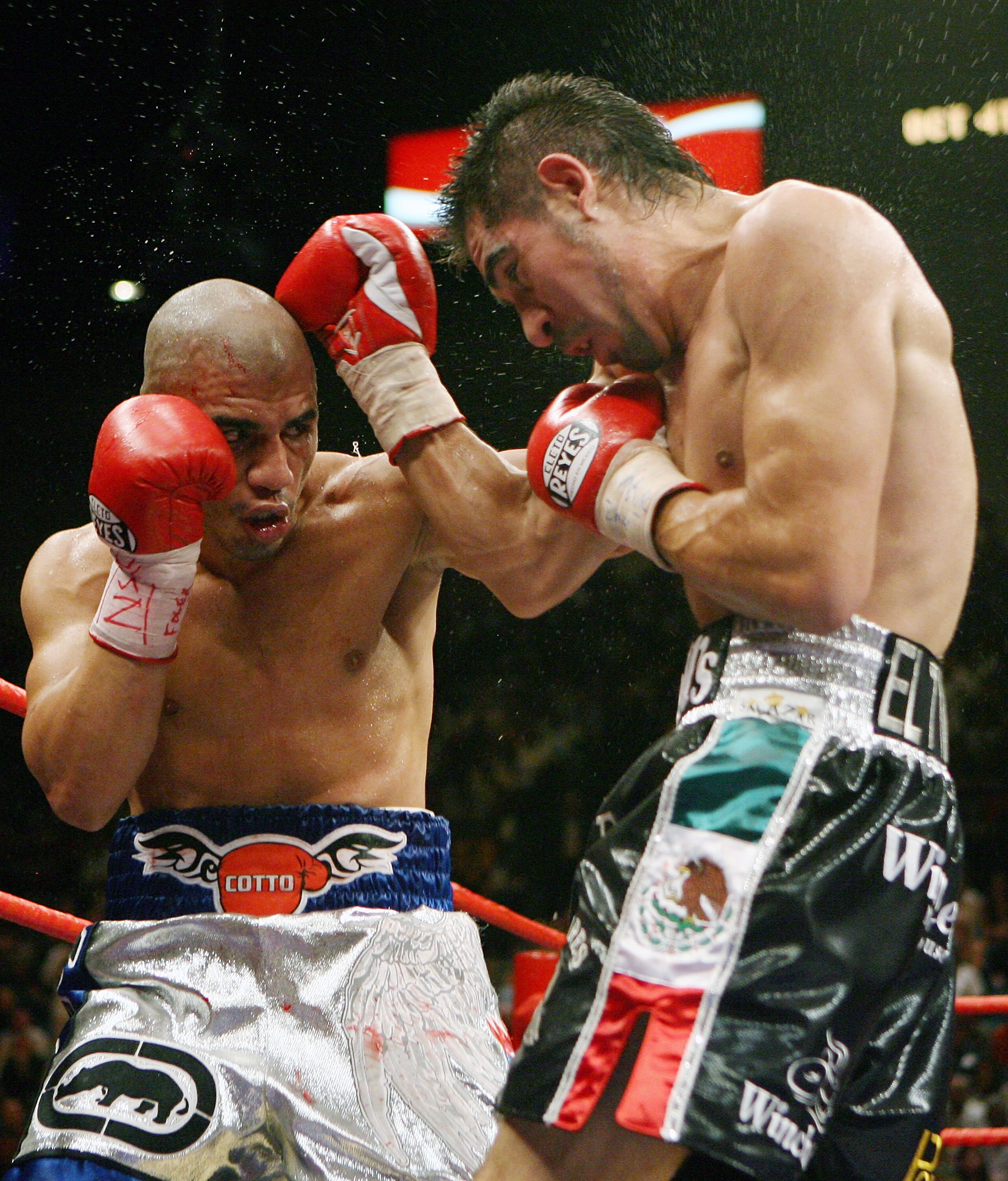 LAS VEGAS - JULY 26:  Miguel Cotto (L) and Antonio Margarito trade blows during their WBA welterweight title fight at the MGM Grand Garden Arena July 26, 2008 in Las Vegas, Nevada. Margarito won by TKO in the 11th round.  (Photo by Ethan Miller/Getty Imag