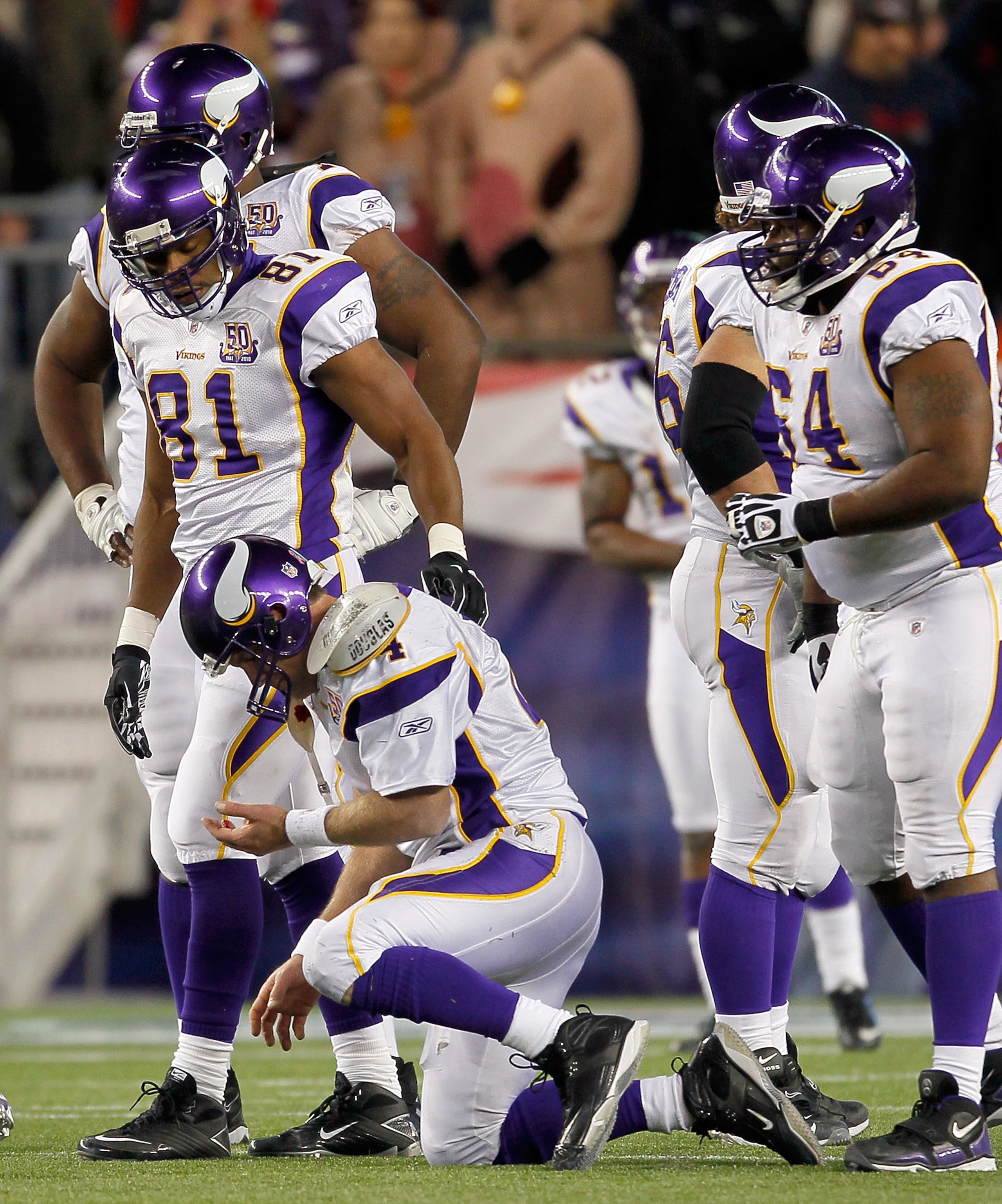 FOXBORO, MA - OCTOBER 31: Brett Favre #4 of the Minnesota Vikings has difficulty walking to the bench after he was hit by Myron Pryor #91 of the New England Patriots in the fourth quarter at Gillette Stadium on October 31, 2010 in Foxboro, Massachusetts. FOXBORO, MA - OCTOBER 31: Brett Favre #4 of the Minnesota Vikings has difficulty walking to the bench after he was hit by Myron Pryor #91 of the New England Patriots in the fourth quarter at Gillette Stadium on October 31, 2010 in Foxboro, Massachusetts.