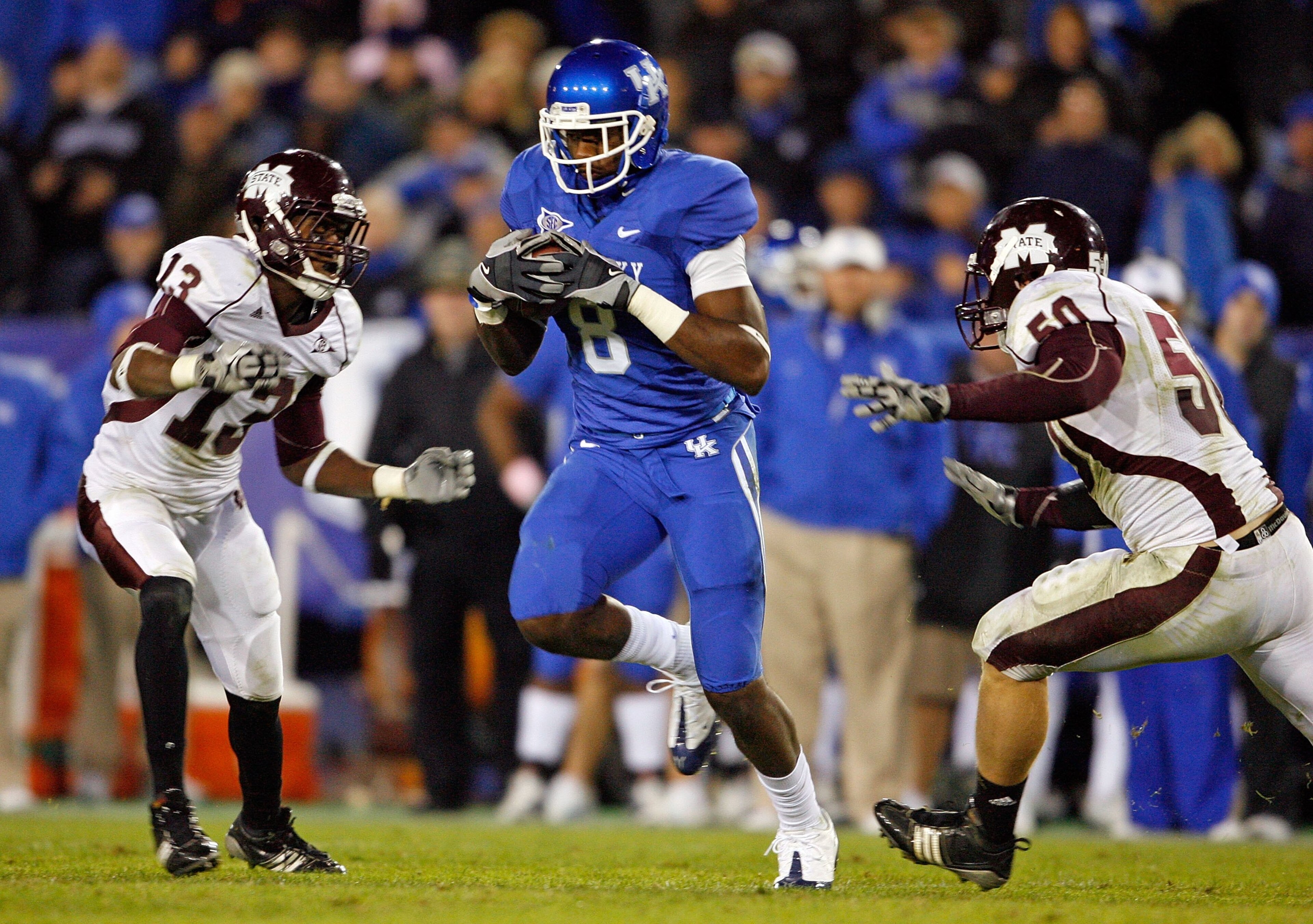 LEXINGTON, KY - OCTOBER 31:  Maurice Langston #15 and Johnthan Banks #13 of the Mississippi State Bulldogs tackles Chris Matthews #8 of the Kentucky Wildcats during the SEC game at Commonwealth Stadium on October 31, 2009 in Lexington, Kentucky.  (Photo b
