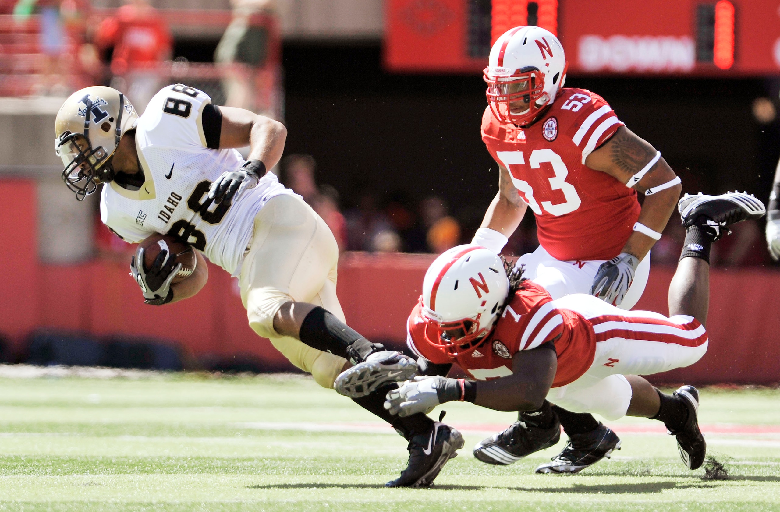 LINCOLN, NEBRASKA - SEPTEMBER 11: Nebraska Cornhuskers defensive back DeJon Gomes #7 trips up Idaho Vandals wide receiver Daniel Hardy #88 during second half action of their game at Memorial Stadium on September 4, 2010 in Lincoln, Nebraska. Nebraska defe LINCOLN, NEBRASKA - SEPTEMBER 11: Nebraska Cornhuskers defensive back DeJon Gomes #7 trips up Idaho Vandals wide receiver Daniel Hardy #88 during second half action of their game at Memorial Stadium on September 4, 2010 in Lincoln, Nebraska. Nebraska defe