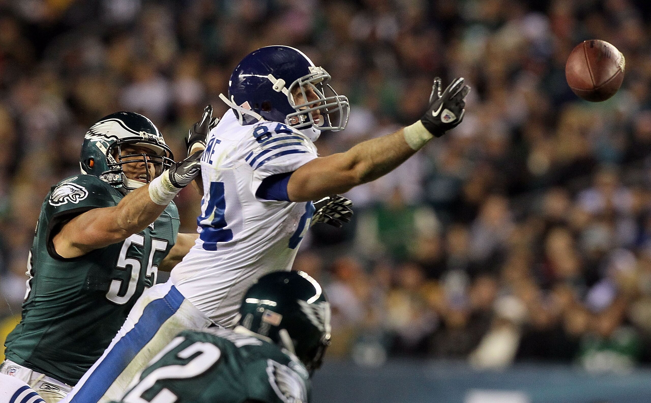 PHILADELPHIA - NOVEMBER 07:  Jacob Tamme #84 of the Indianapolis Colts can not come up with a pass as he is defended by Stewart Bradley #55 of the Philadelphia Eagles on November 7, 2010 at Lincoln Financial Field in Philadelphia, Pennsylvania. The Eagles