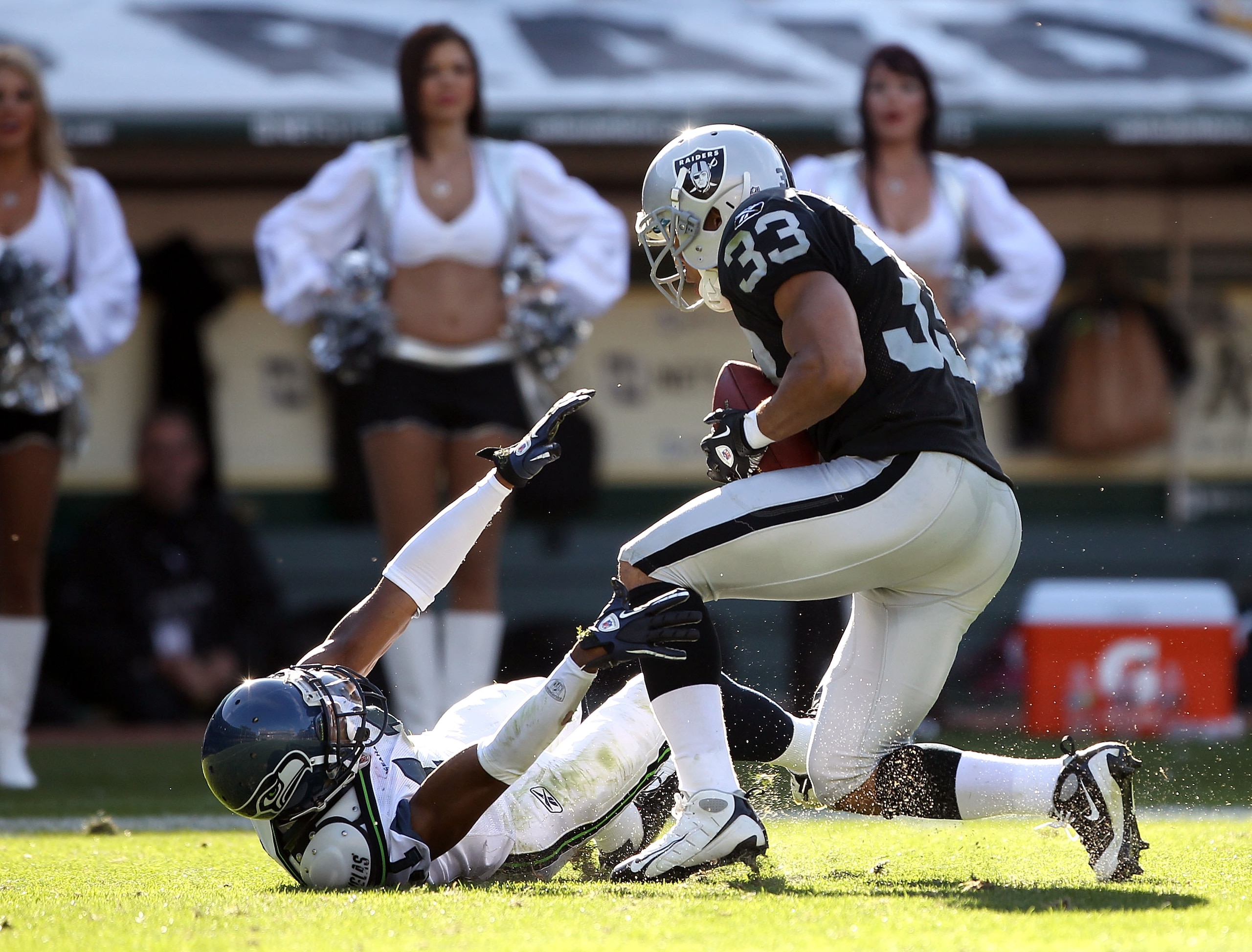 OAKLAND, CA - OCTOBER 31:  Tyvon Branch #33 of the Oakland Raiders makes an interception when Deon Butler #11 of the Seattle Seahawks bobbled the ball at Oakland-Alameda County Coliseum on October 31, 2010 in Oakland, California.  (Photo by Ezra Shaw/Gett