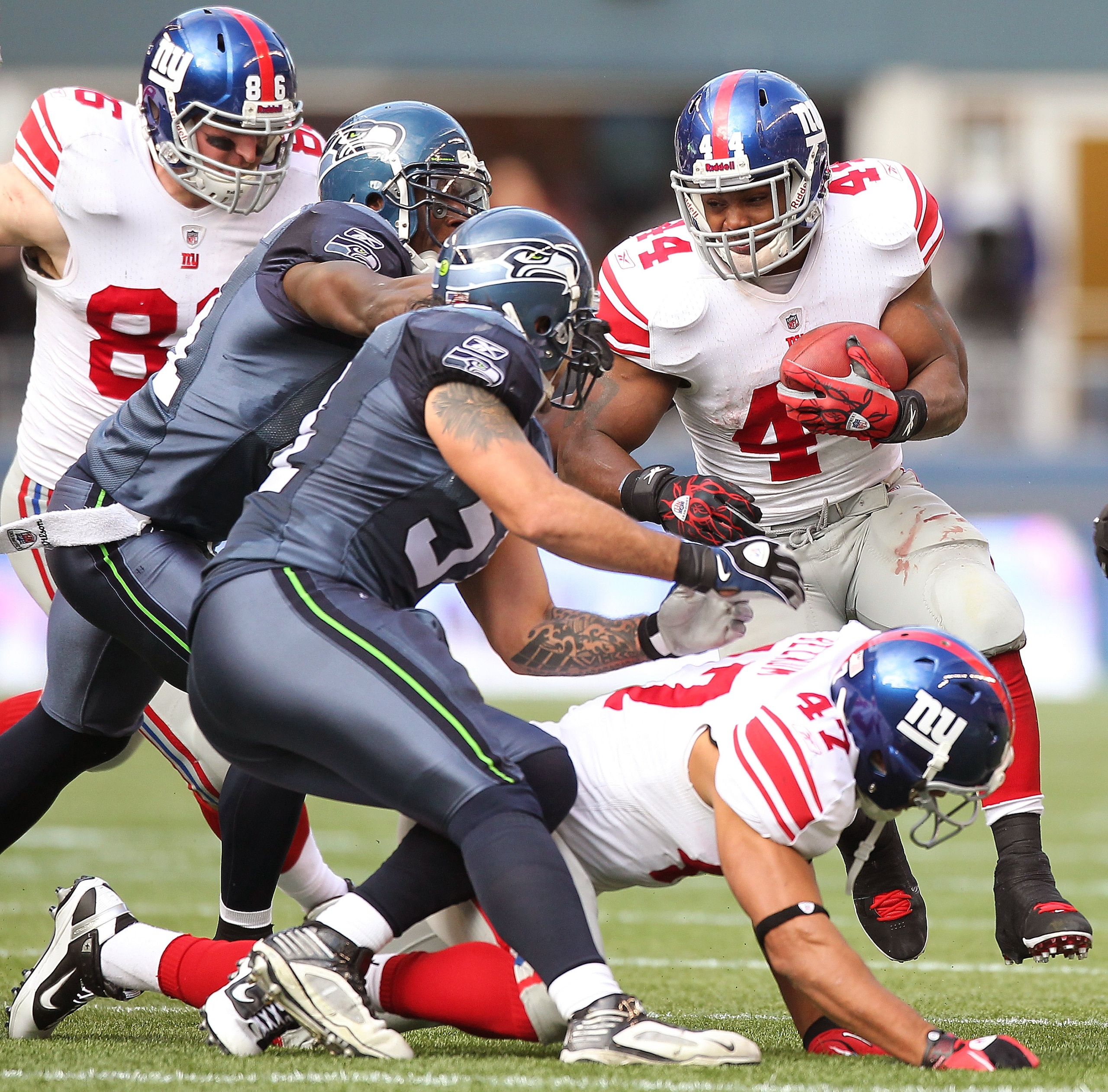 SEATTLE - NOVEMBER 07:  Running back Ahmad Bradshaw #44 of the New York Giants rushes against the Seattle Seahawks at Qwest Field on November 7, 2010 in Seattle, Washington. The Giants defeated the Seahawks 41-7. (Photo by Otto Greule Jr/Getty Images)