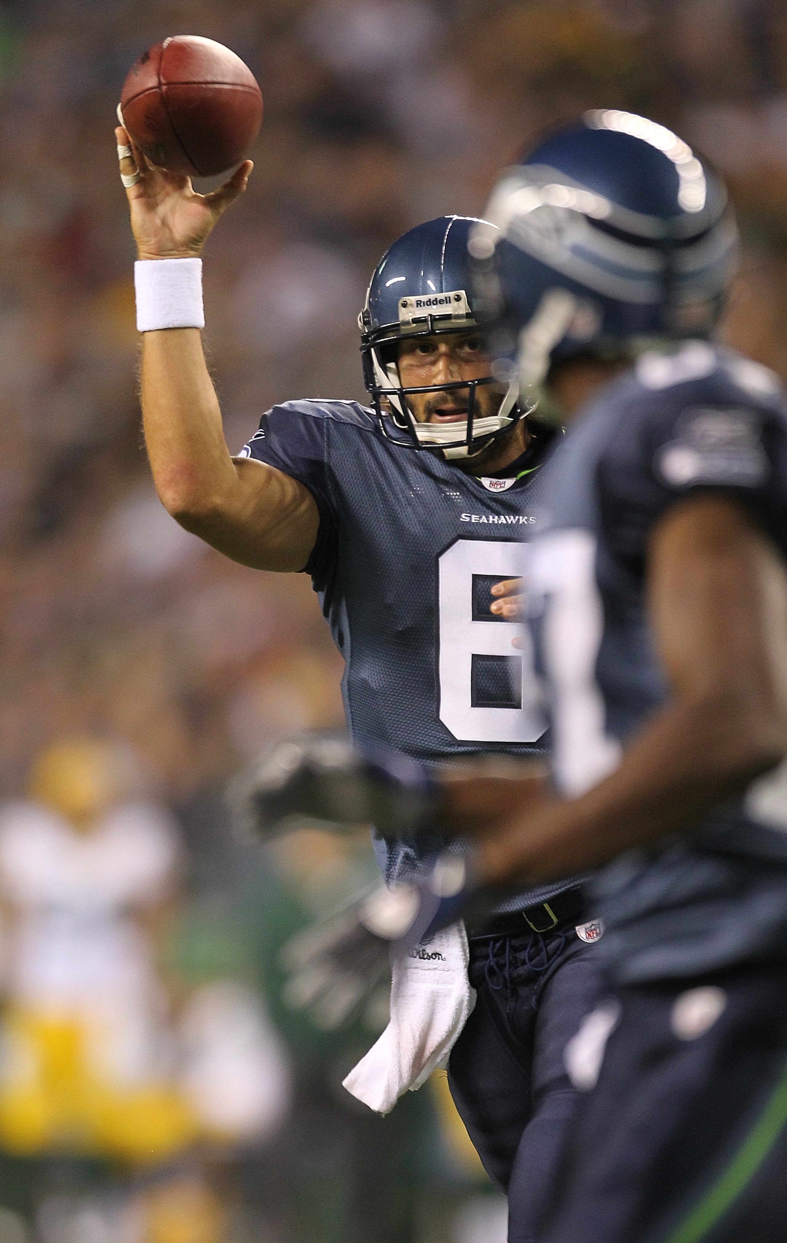 SEATTLE - AUGUST 21:  Quarterback Charlie Whitehurst #6 of the Seattle Seahawks throws a touchdown pass to Ben Obomanu #87 during the preseason game against the Green Bay Packers at Qwest Field on August 21, 2010 in Seattle, Washington. (Photo by Otto Gre