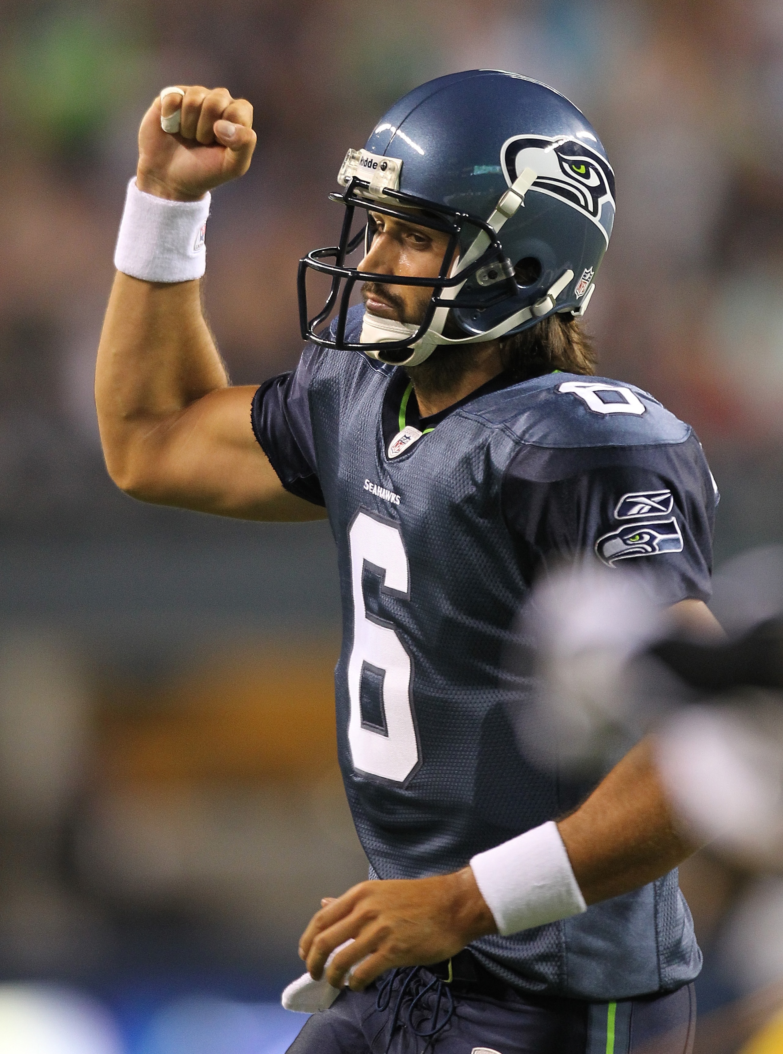 SEATTLE - AUGUST 21:  Quarterback Charlie Whitehurst #6 of the Seattle Seahawks celebrates after the Seahawks scored a touchdown during the preseason game against the Green Bay Packers at Qwest Field on August 21, 2010 in Seattle, Washington. (Photo by Ot