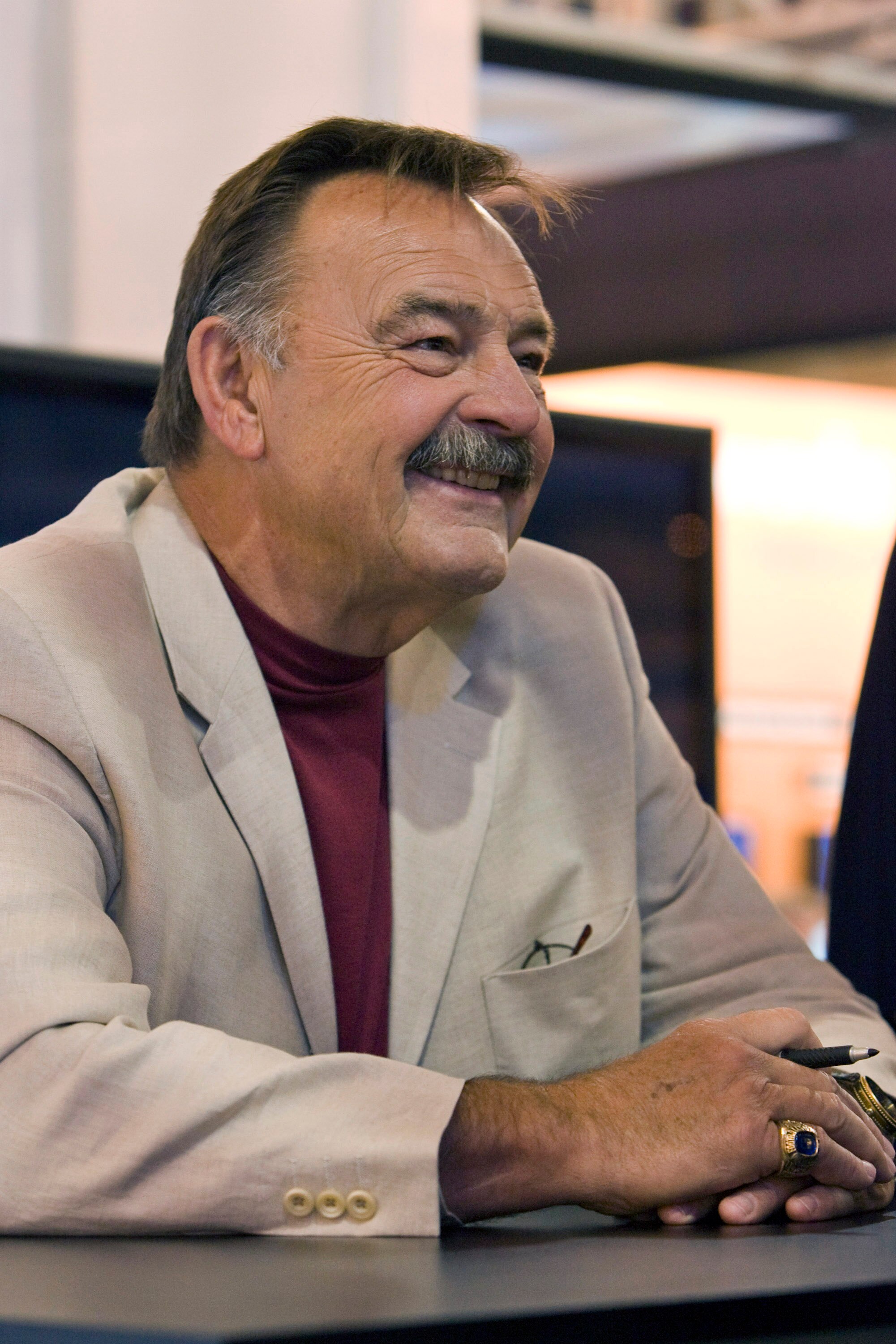 NEW ORLEANS - MAY 19: 2008 Pro Football Hall of Fame member and legendary Chicago Bears linebacker Dick Butkus takes time to sign footballs for fans in the Fox Cable Networks' booth at the The Cable Show in the Ernest N. Morial Convention Center on May 19