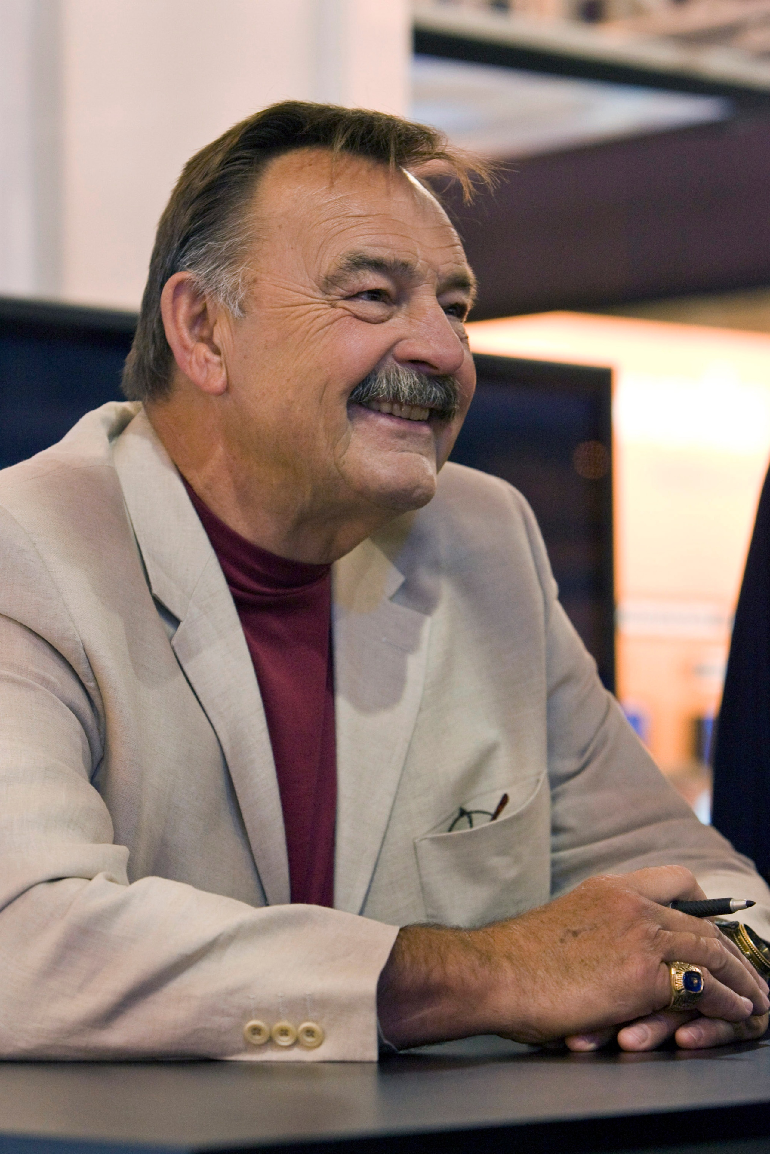 NEW ORLEANS - MAY 19: 2008 Pro Football Hall of Fame member and legendary Chicago Bears linebacker Dick Butkus takes time to sign footballs for fans in the Fox Cable Networks' booth at the The Cable Show in the Ernest N. Morial Convention Center on May 19 NEW ORLEANS - MAY 19: 2008 Pro Football Hall of Fame member and legendary Chicago Bears linebacker Dick Butkus takes time to sign footballs for fans in the Fox Cable Networks' booth at the The Cable Show in the Ernest N. Morial Convention Center on May 19