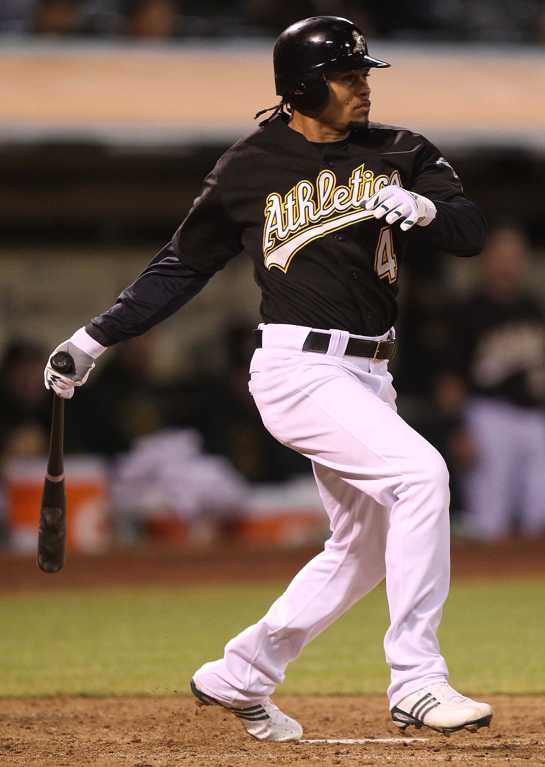 OAKLAND, CA - SEPTEMBER 08:  Coco Crisp #4 of the Oakland Athletics hits an RBI single in the sixth inning against the Seattle Mariners during a Major League Baseball game at the Oakland-Alameda County Coliseum on September 8, 2010 in Oakland, California.