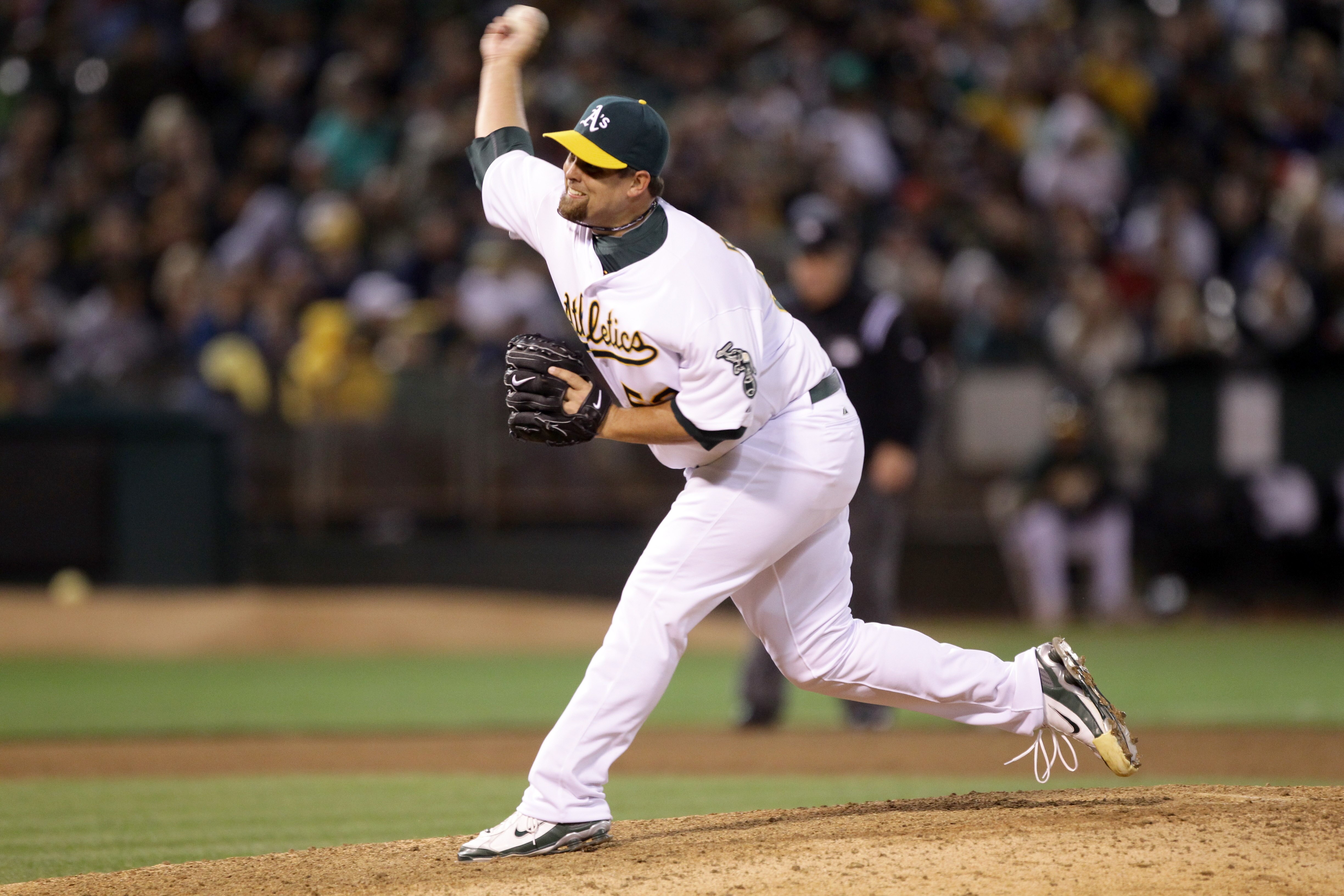 OAKLAND, CA - AUGUST 06:  Boof Bonser #52 of the Oakland Athletics pitches against the Texas Rangers at the Oakland-Alameda County Coliseum on August 6, 2010 in Oakland, California.  (Photo by Ezra Shaw/Getty Images)