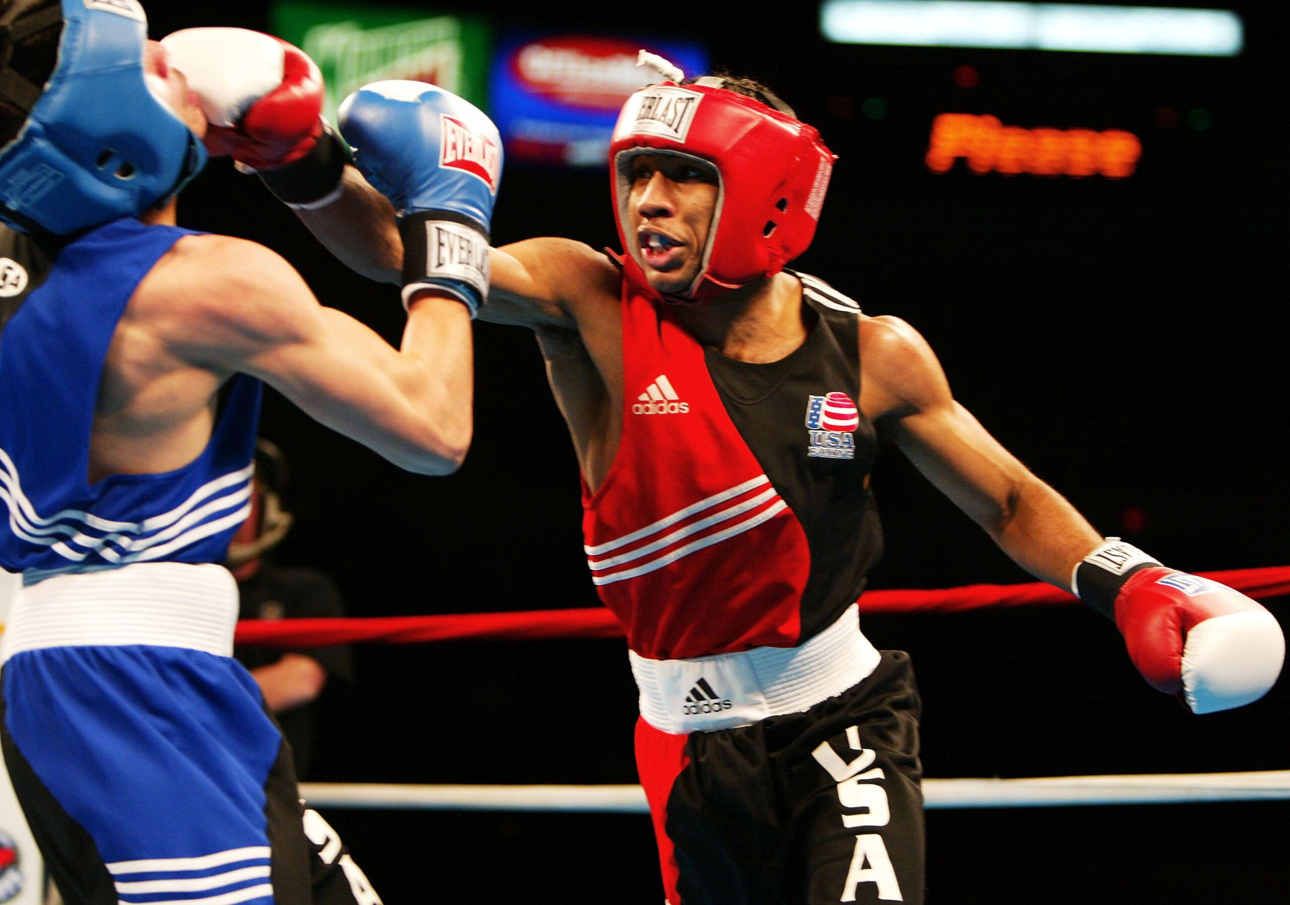 CLEVELAND, OH - FEBRUARY 27: Mickey Bey Jr. of Cleveland, Ohio lands a punch during his featherweight (125lbs) match against Brandon Rios of Garden City, Kansas during the 2004 Olympic Box-Offs at the Cleveland Convocation Center February 27, 2004 in Cl CLEVELAND, OH - FEBRUARY 27: Mickey Bey Jr. of Cleveland, Ohio lands a punch during his featherweight (125lbs) match against Brandon Rios of Garden City, Kansas during the 2004 Olympic Box-Offs at the Cleveland Convocation Center February 27, 2004 in Cl