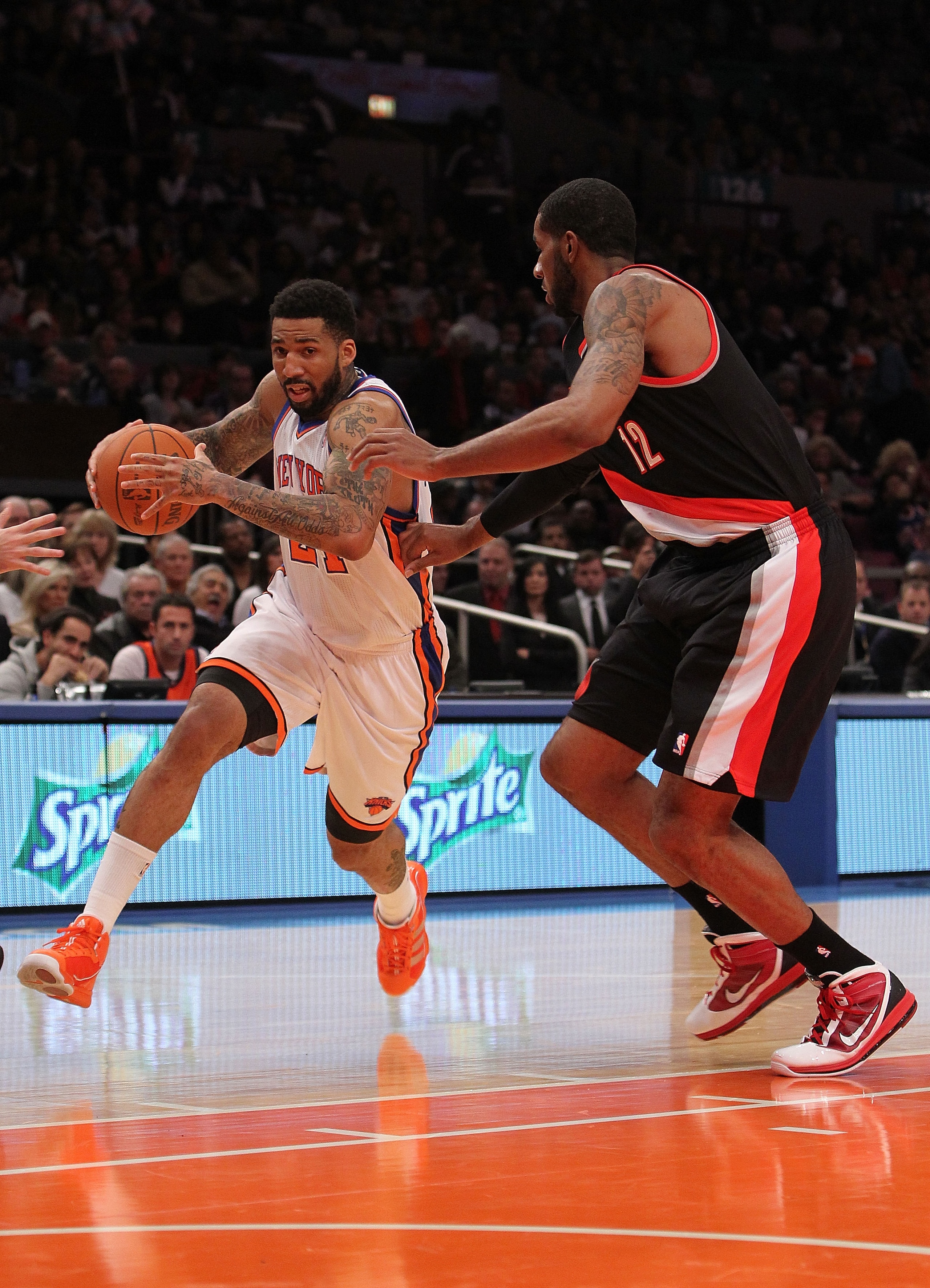 NEW YORK - OCTOBER 30:  Wilson Chandler #21 of the New York Knicks drives to the basket against LaMarcus Aldridge #12 of the Portland Trail Blazers at Madison Square Garden on October 30, 2010 in New York City. NOTE TO USER: User expressly acknowledges an