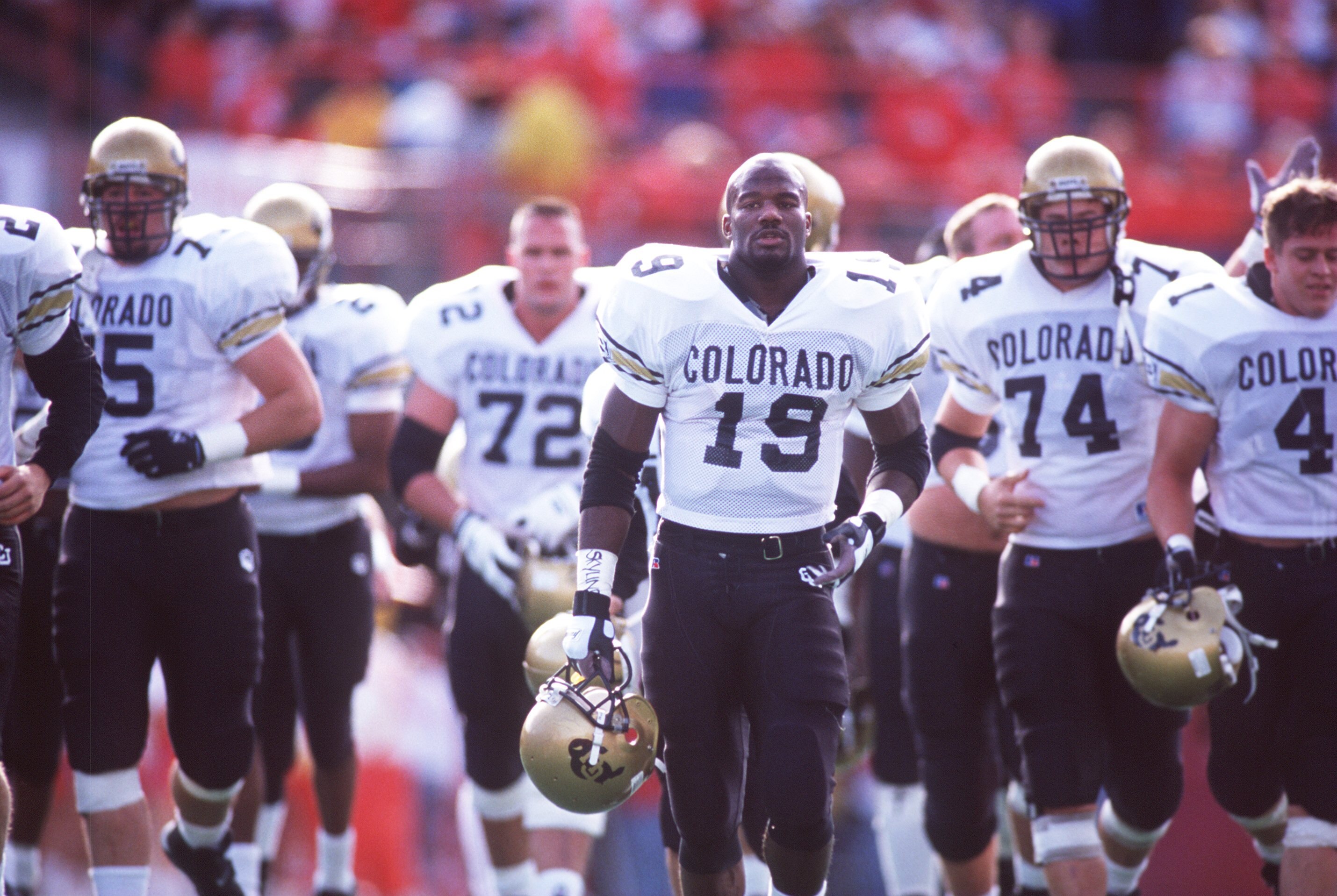 29 OCT 1994:  COLORADO RUNNING BACK RASHAAN SALAAM LEADS HIS TEAM ON TO THE FIELD BEFORE THE BUFFALOES 24-7 LOSS TO THE NEBRASKA CORNHUSKERS AT MEMORIAL STADIUM IN LINCOLN, NEBRASKA. Mandatory Credit: Todd Rosenberg/ALLSPORT