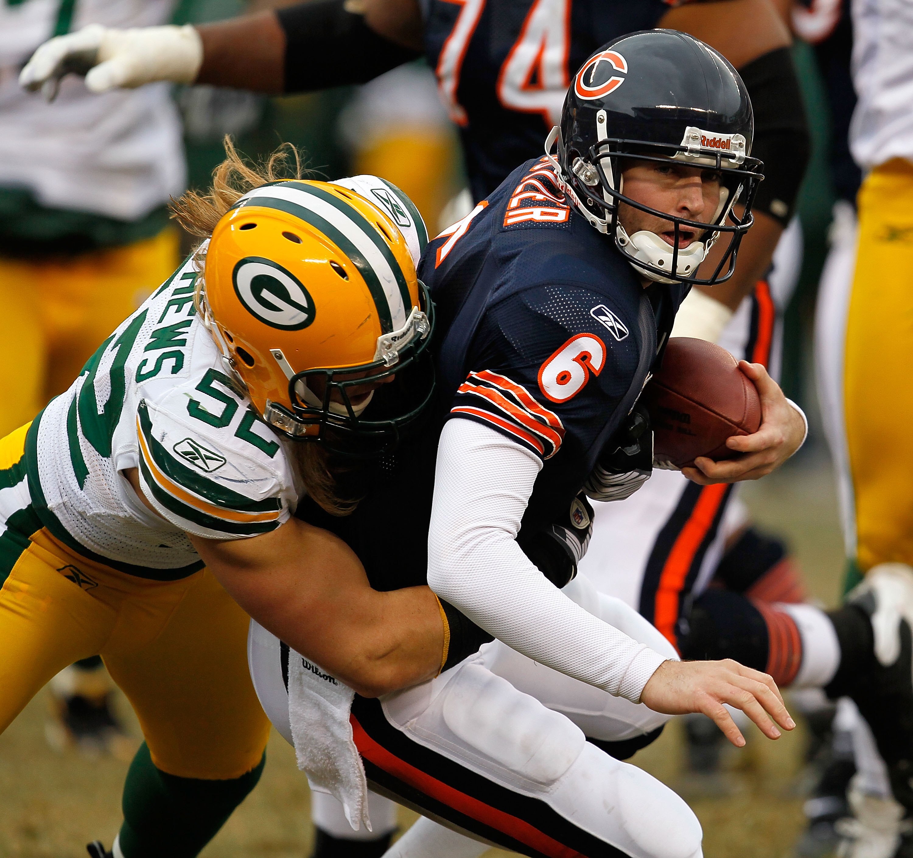 CHICAGO - DECEMBER 13: Clay Matthews #52 of the Green Bay Packers sacks Jay Cutler #6 of the Chicago Bears at Soldier Field on December 13, 2009 in Chicago, Illinois. The Packers defeated the Bears 21-14. (Photo by Jonathan Daniel/Getty Images)