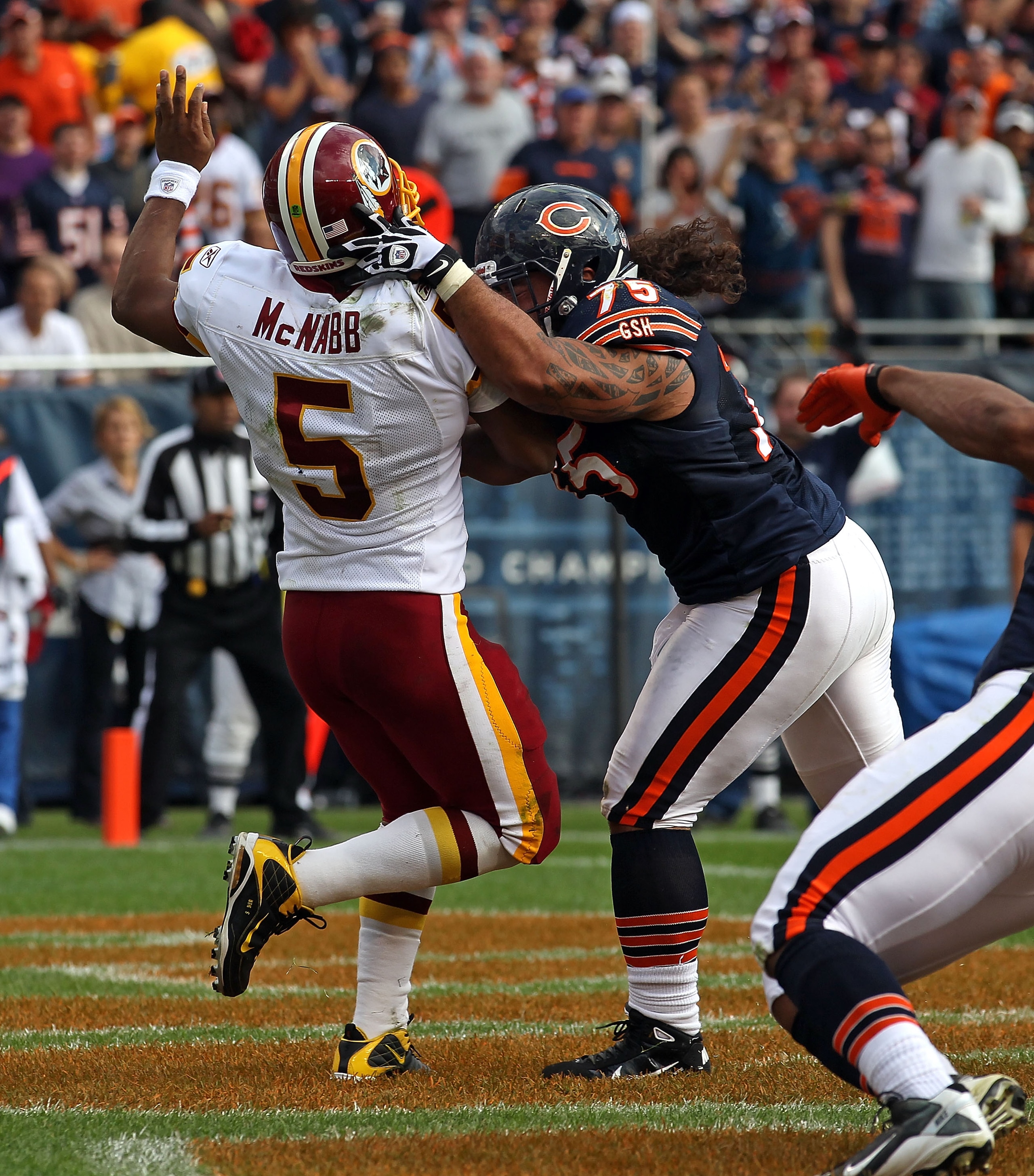CHICAGO - OCTOBER 24: Matt Toeaina #75 of the Chicago Bears hits Donovan McNabb #5 of the Washington Redskins after a pass at Soldier Field on October 24, 2010 in Chicago, Illinois. The Redskins defeated the Bears 17-14. (Photo by Jonathan Daniel/Getty Im