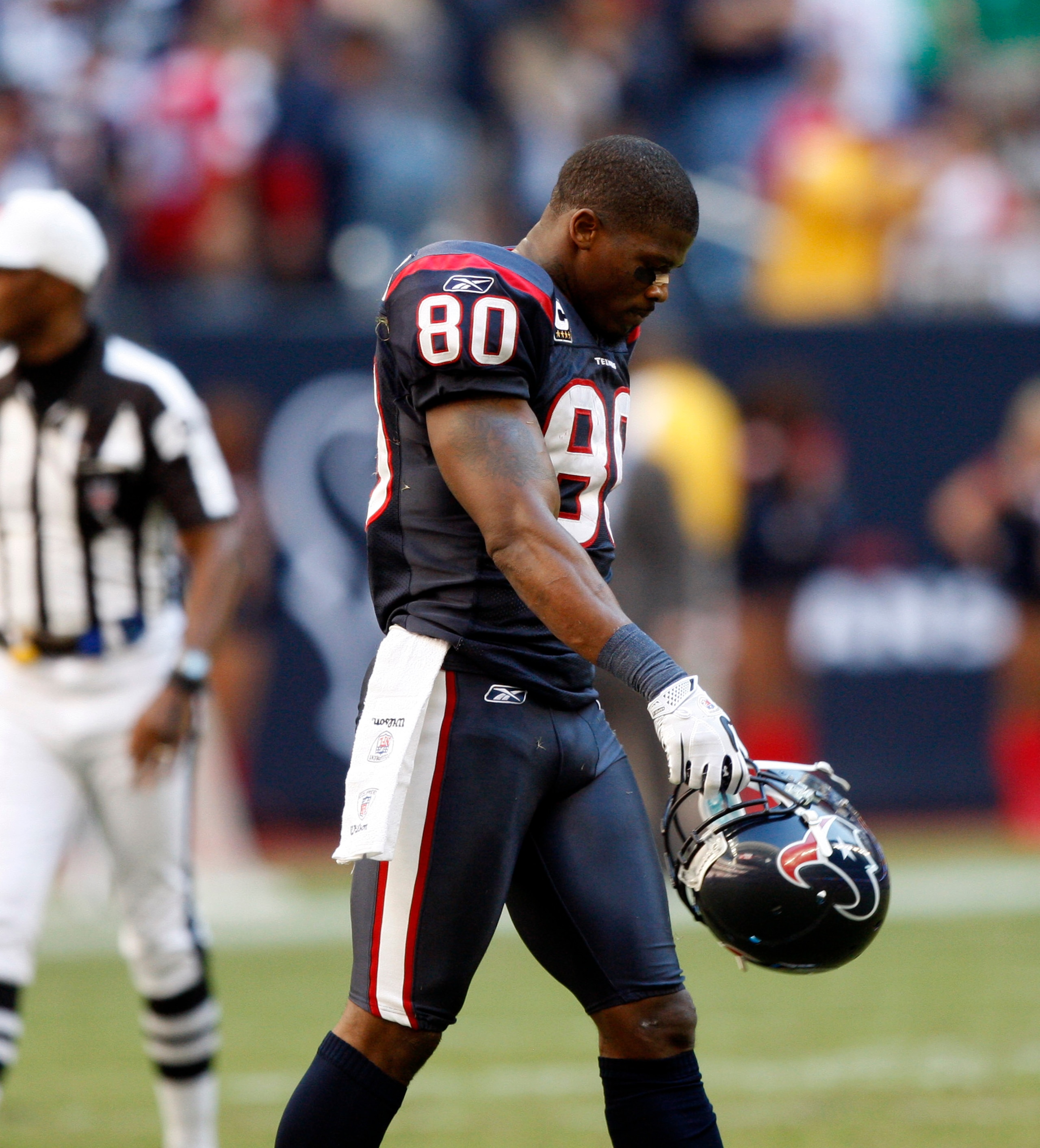 HOUSTON - NOVEMBER 07:  Wide receiver Andre Johnson #80 walks off the field after losing control of a pass that was intercepted by San Diego Charger Paul Oliver at Reliant Stadium on November 7, 2010 in Houston, Texas.  (Photo by Bob Levey/Getty Images)