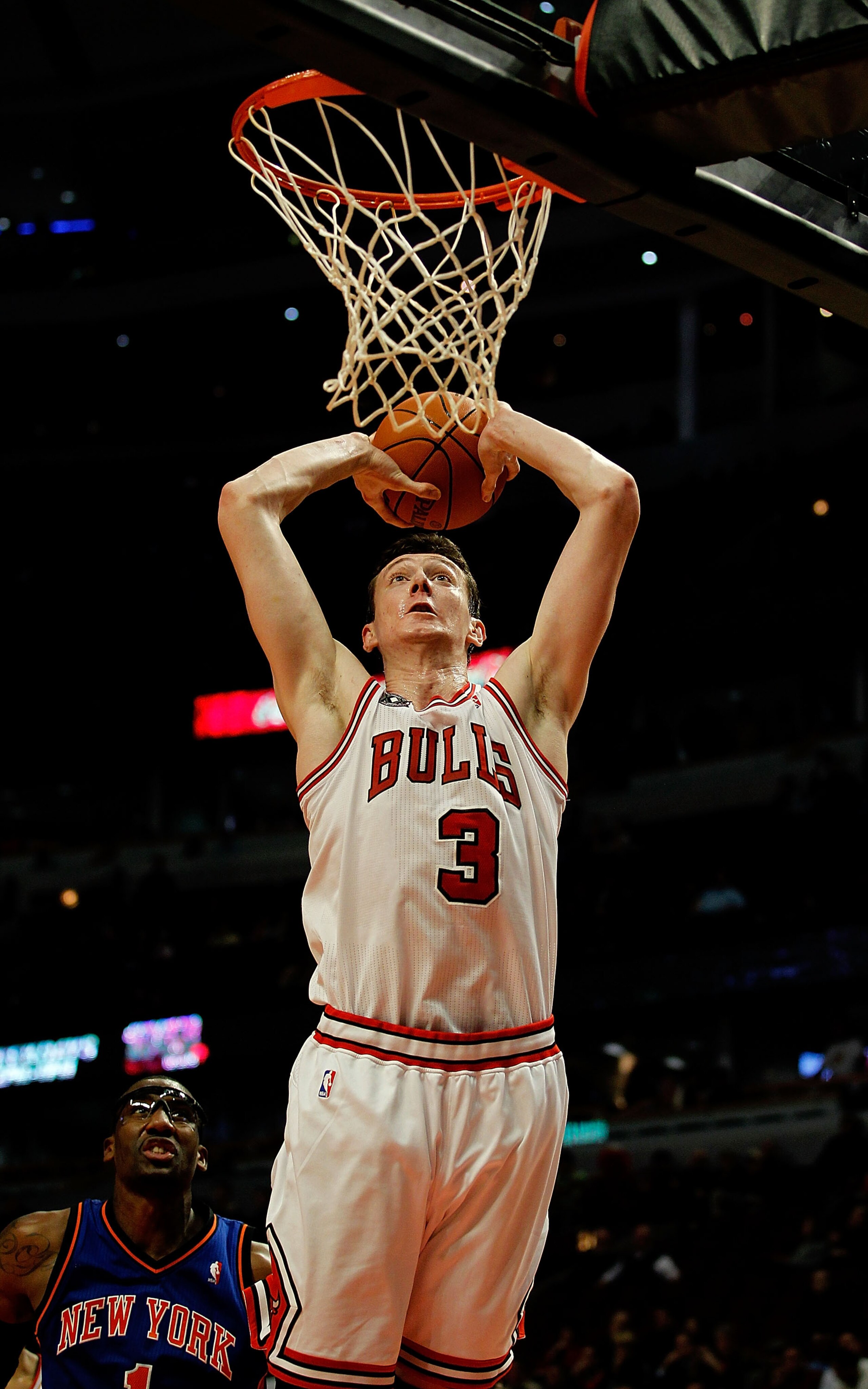 CHICAGO - NOVEMBER 04: Omer Asik #3 of the Chicago Bulls goes up for a dunk past Amar'e Stoudemire #1 of the New York Knicks at the United Center on November 4, 2010 in Chicago, Illinois. The Knicks defeated the Bulls 120-112. NOTE TO USER: User expressly