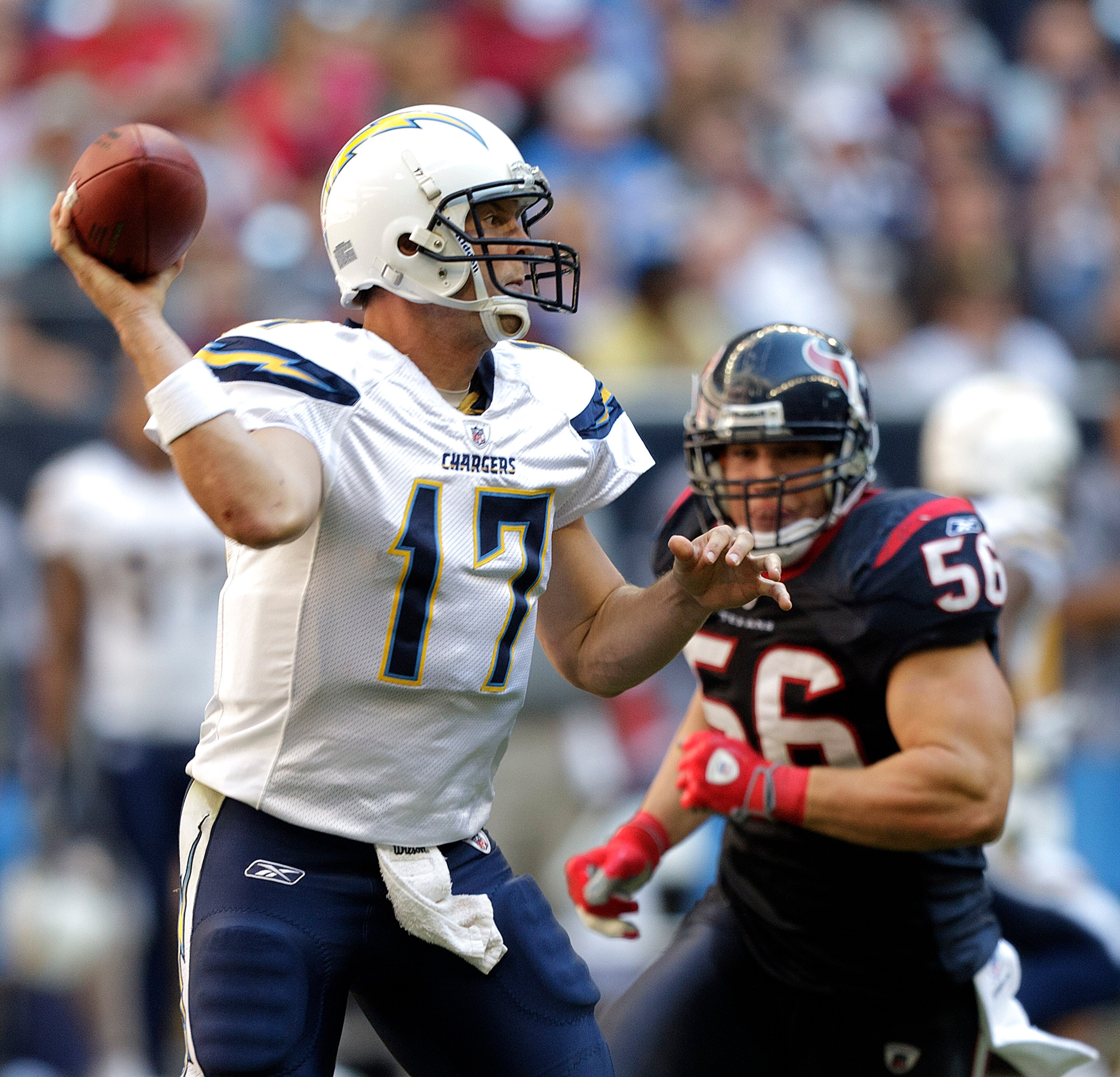HOUSTON - NOVEMBER 07: Quarterback Philip Rivers #17 of the San Diego Chargers throws downfield as linebacker Brian Cushing #56 of the Houston Texans applies pressure at Reliant Stadium on November 7, 2010 in Houston, Texas. (Photo by Bob Levey/Getty Im HOUSTON - NOVEMBER 07: Quarterback Philip Rivers #17 of the San Diego Chargers throws downfield as linebacker Brian Cushing #56 of the Houston Texans applies pressure at Reliant Stadium on November 7, 2010 in Houston, Texas. (Photo by Bob Levey/Getty Im