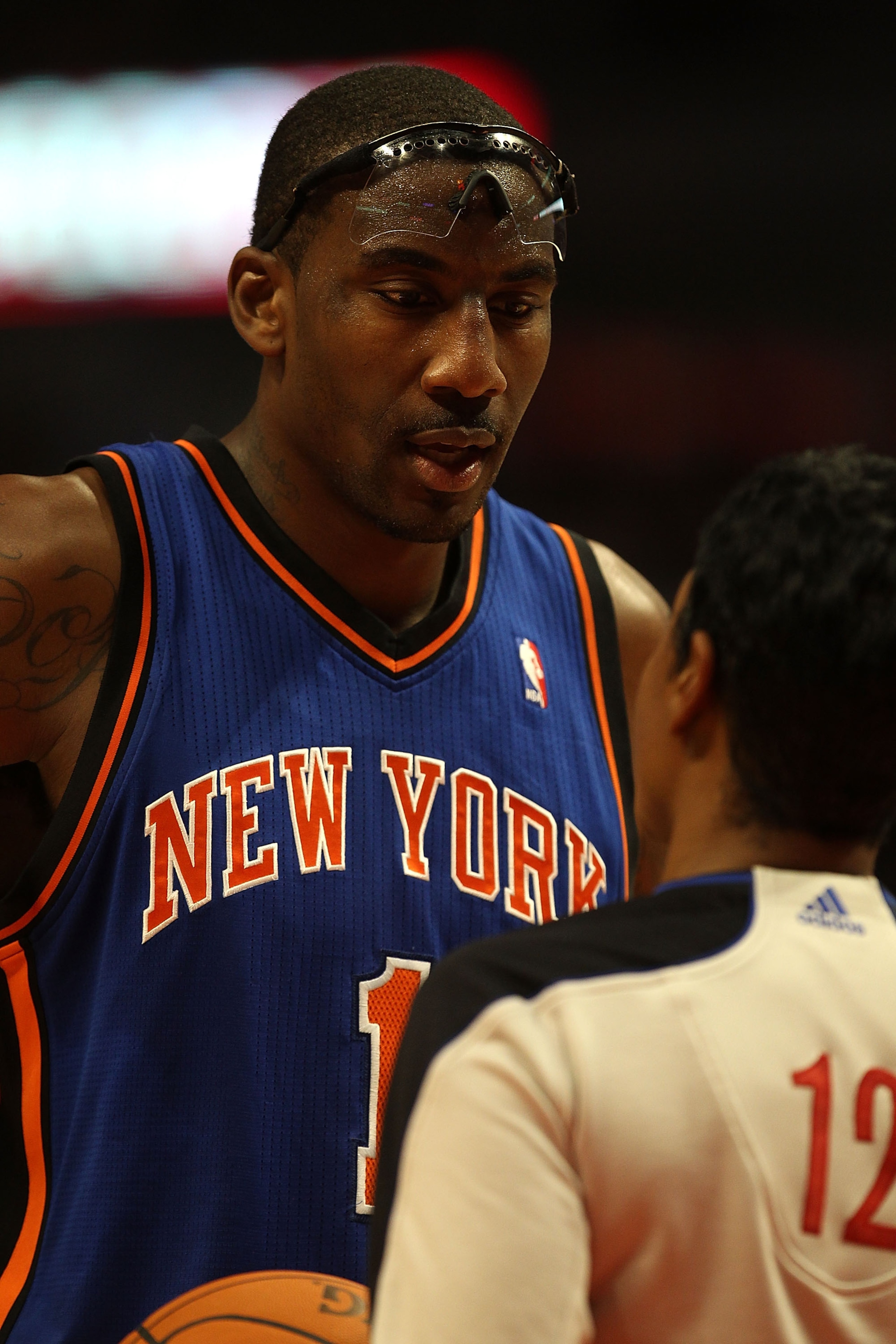 CHICAGO - NOVEMBER 04: Amar'e Stoudemire #1 of the New York Knicks talks with referee Violet Palmer #12 as he waits at the free-throw line during a game against the Chicago Bulls at the United Center on November 4, 2010 in Chicago, Illinois. The Knicks de