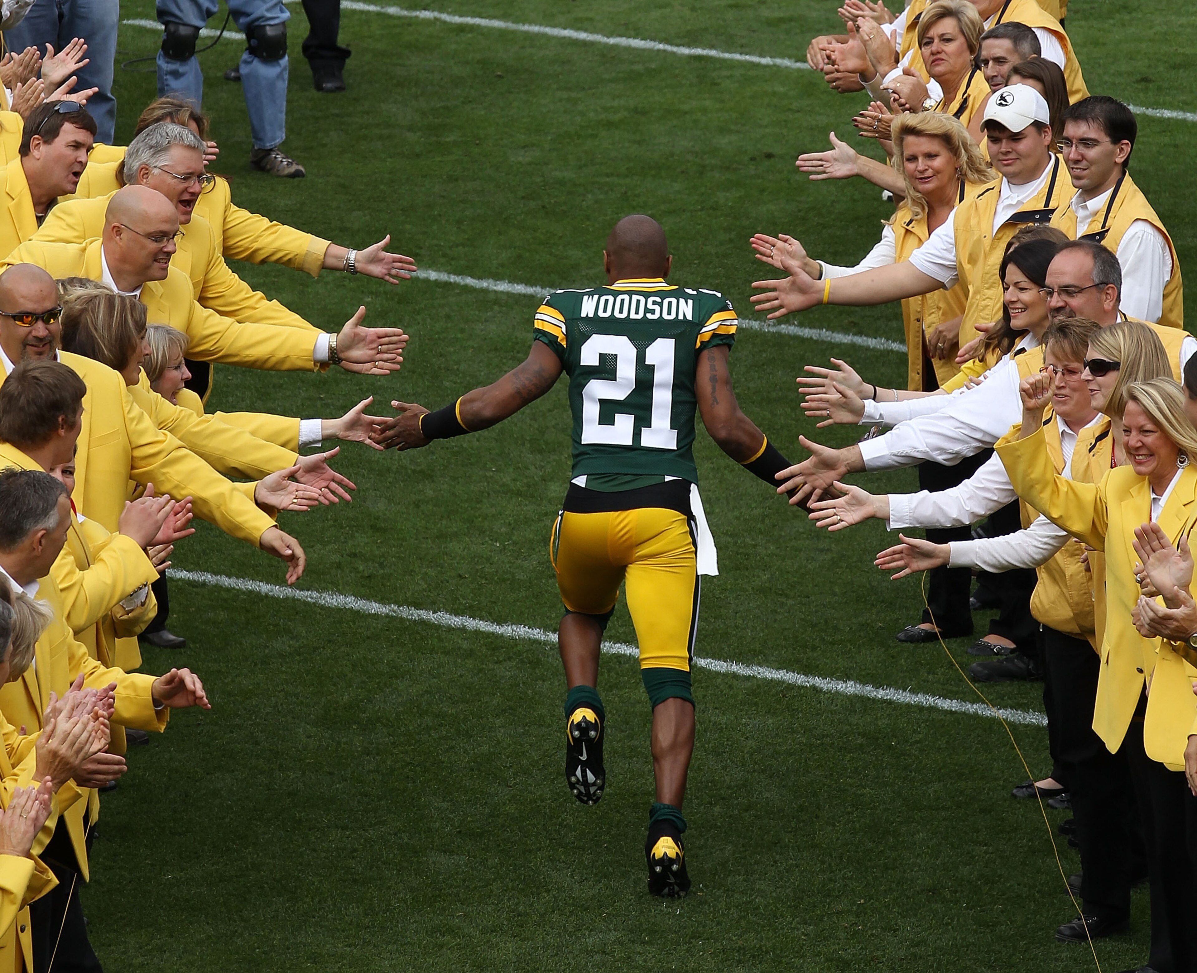 GREEN BAY, WI - SEPTEMBER 19: Charles Woodson #21 of the Green Bay Packers runs onto the field during player introductions before a game against the Buffalo Bills at Lambeau Field on September 19, 2010 in Green Bay, Wisconsin. (Photo by Jonathan Daniel/Ge GREEN BAY, WI - SEPTEMBER 19: Charles Woodson #21 of the Green Bay Packers runs onto the field during player introductions before a game against the Buffalo Bills at Lambeau Field on September 19, 2010 in Green Bay, Wisconsin. (Photo by Jonathan Daniel/Ge