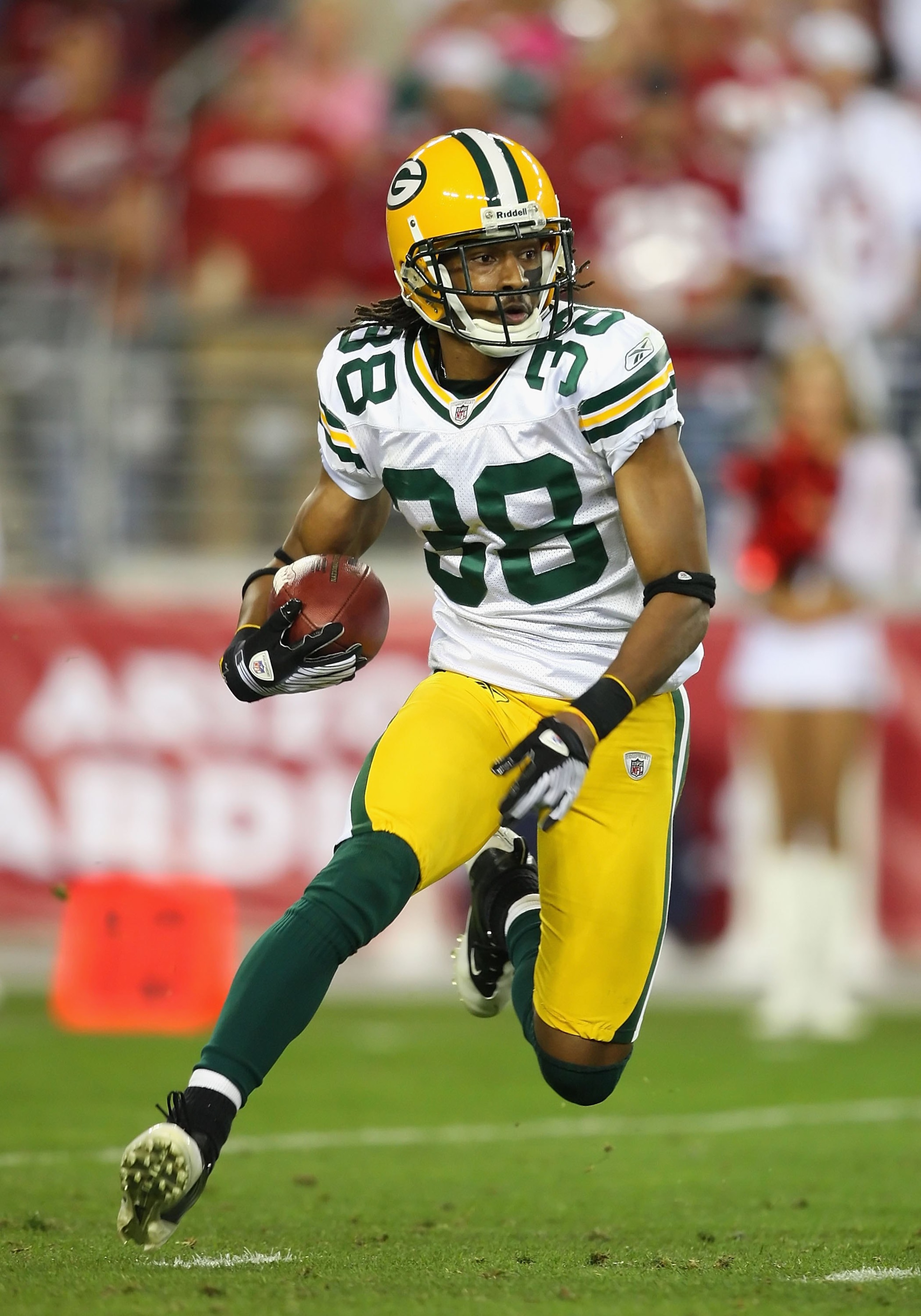 GLENDALE, AZ - JANUARY 10:  Tramon Williams #38 of the Green Bay Packers returns a kick off during the 2010 NFC wild-card playoff game against the Arizona Cardinals at the Universtity of Phoenix Stadium on January 10, 2010 in Glendale, Arizona.  The Cardi