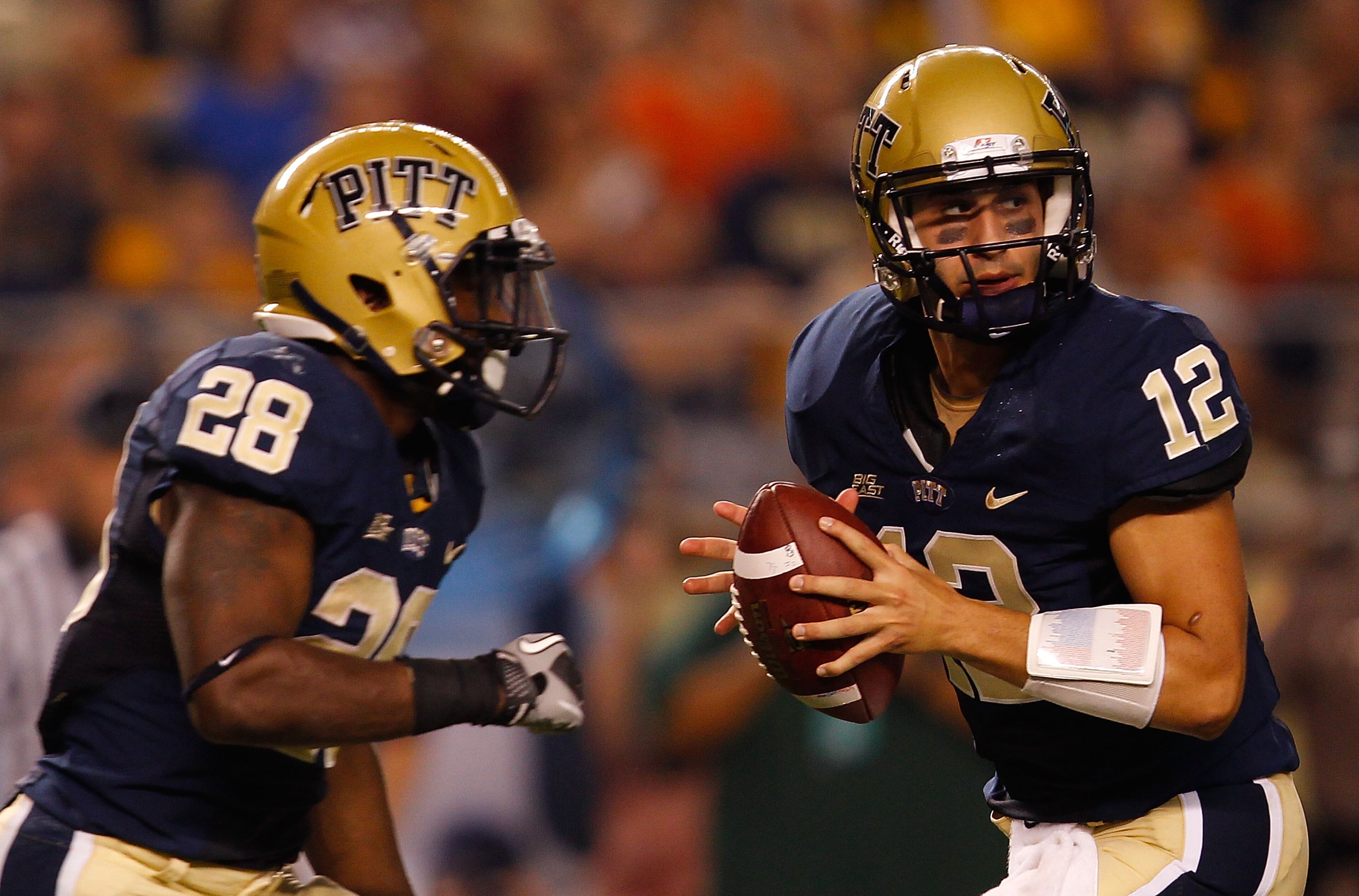 PITTSBURGH - SEPTEMBER 23: Tino Sunseri #12 of the Pittsburgh Panthers drops back to pass in front of teammate Dion Lewis #28 during the game against the Miami Hurricanes on September 23, 2010 at Heinz Field in Pittsburgh, Pennsylvania. (Photo by Jared PITTSBURGH - SEPTEMBER 23: Tino Sunseri #12 of the Pittsburgh Panthers drops back to pass in front of teammate Dion Lewis #28 during the game against the Miami Hurricanes on September 23, 2010 at Heinz Field in Pittsburgh, Pennsylvania. (Photo by Jared