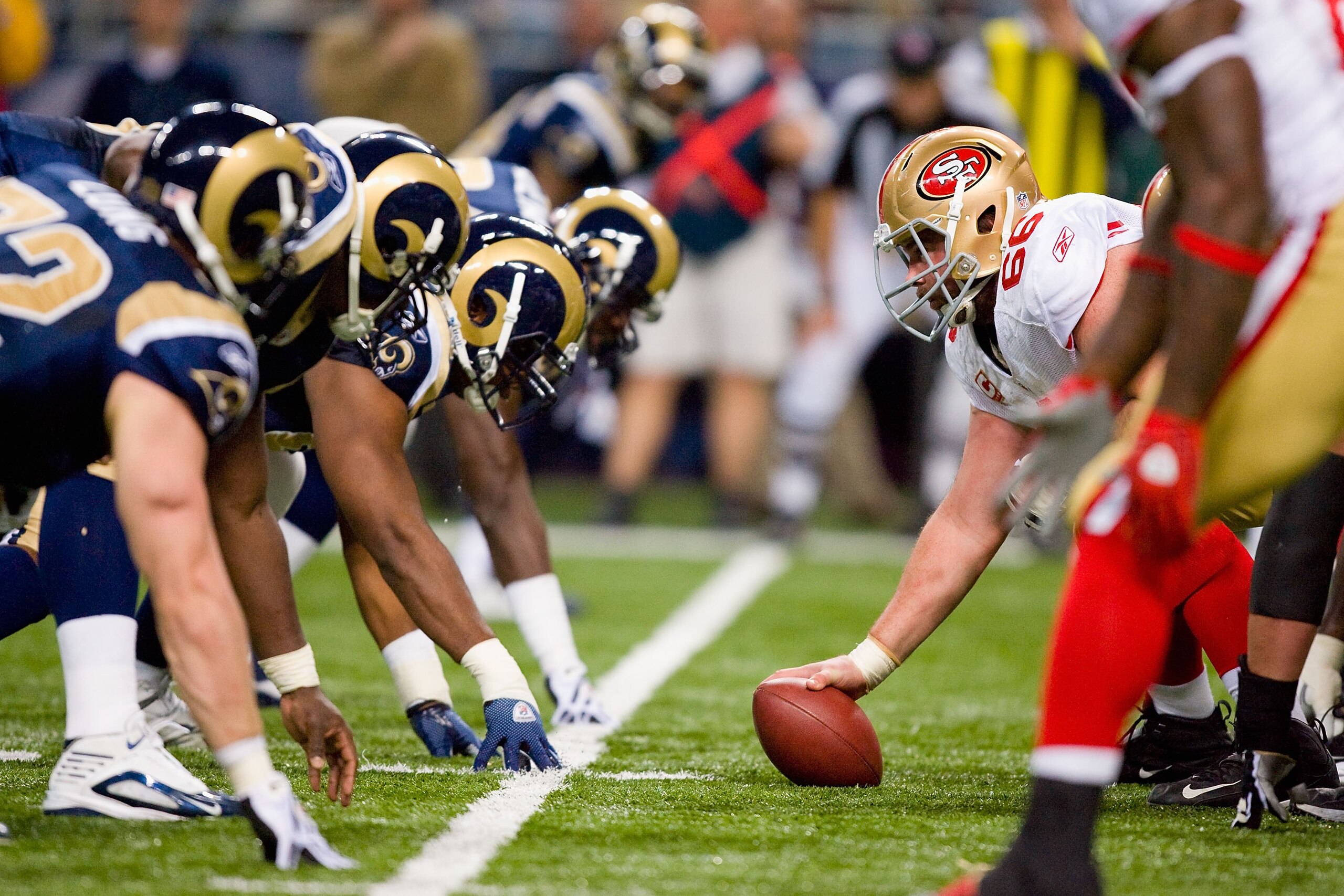 ST. LOUIS - JANUARY 3:  Center Eric Heitmann #66 of the San Francisco 49ers gets ready to hike the ball during the game against the St. Louis Rams at the Edward Jones Dome on January 3, 2010 in St. Louis, Missouri.  The 49ers beat the Rams 28-6.  (Photo b