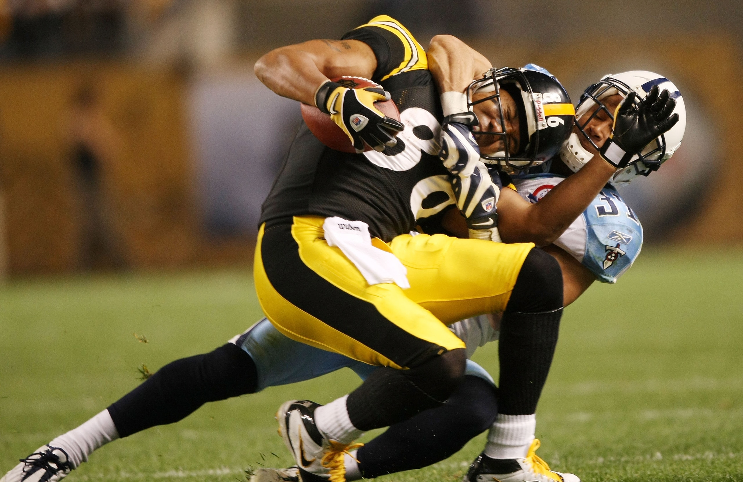 PITTSBURGH - SEPTEMBER 11: Hines Ward #86 of the Pittsburgh Steelers is pulled down by Cortland Finnegan #31 of the Tennessee Titans on September 11, 2009 at Heinz Field in Pittsburgh, Pennsylvania. The Steelers defeated the Titans 13-10 in overtime. ( PITTSBURGH - SEPTEMBER 11: Hines Ward #86 of the Pittsburgh Steelers is pulled down by Cortland Finnegan #31 of the Tennessee Titans on September 11, 2009 at Heinz Field in Pittsburgh, Pennsylvania. The Steelers defeated the Titans 13-10 in overtime. (
