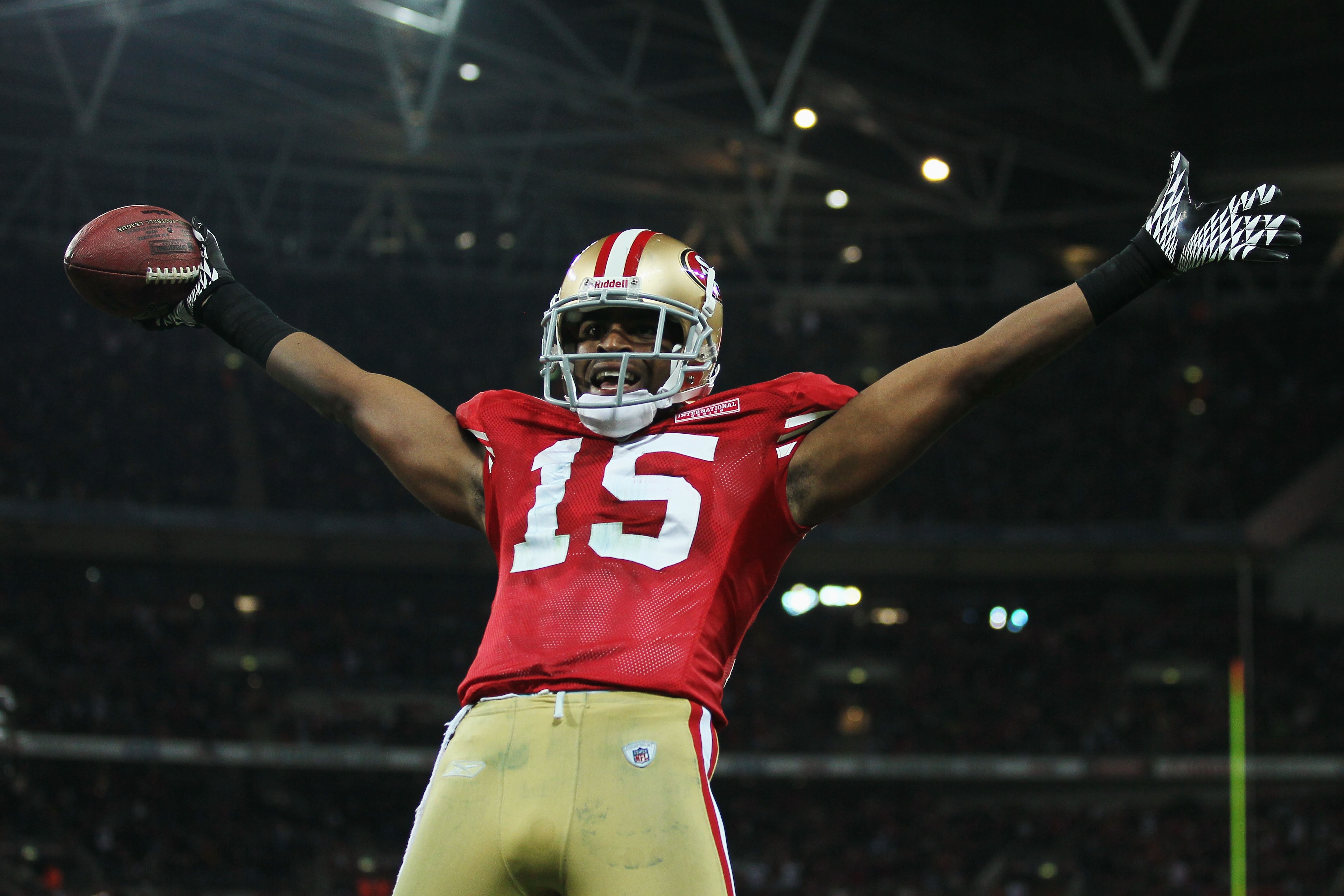 LONDON, ENGLAND - OCTOBER 31:  Michael Crabtree #15 of San Francisco 49ers celebrates as he scores their second touchdown during the NFL International Series match between Denver Broncos and San Francisco 49ers at Wembley Stadium on October 31, 2010 in Lo