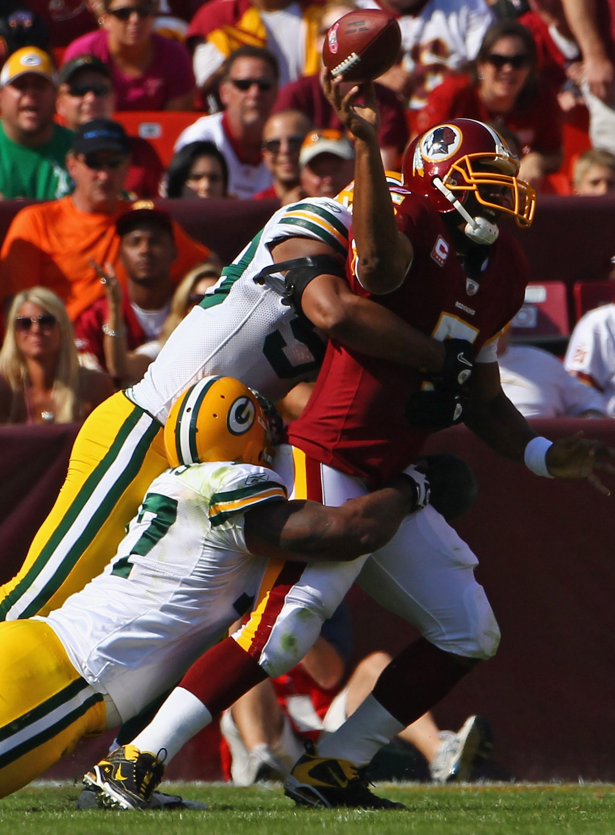 LANDOVER, MD - OCTOBER 10: Quarterback Donovan McNabb #5 of the Washington Redskins is sacked by the Green Bay Packers defense at FedExField on October 10, 2010 in Landover, Maryland.  (Photo by Win McNamee/Getty Images)