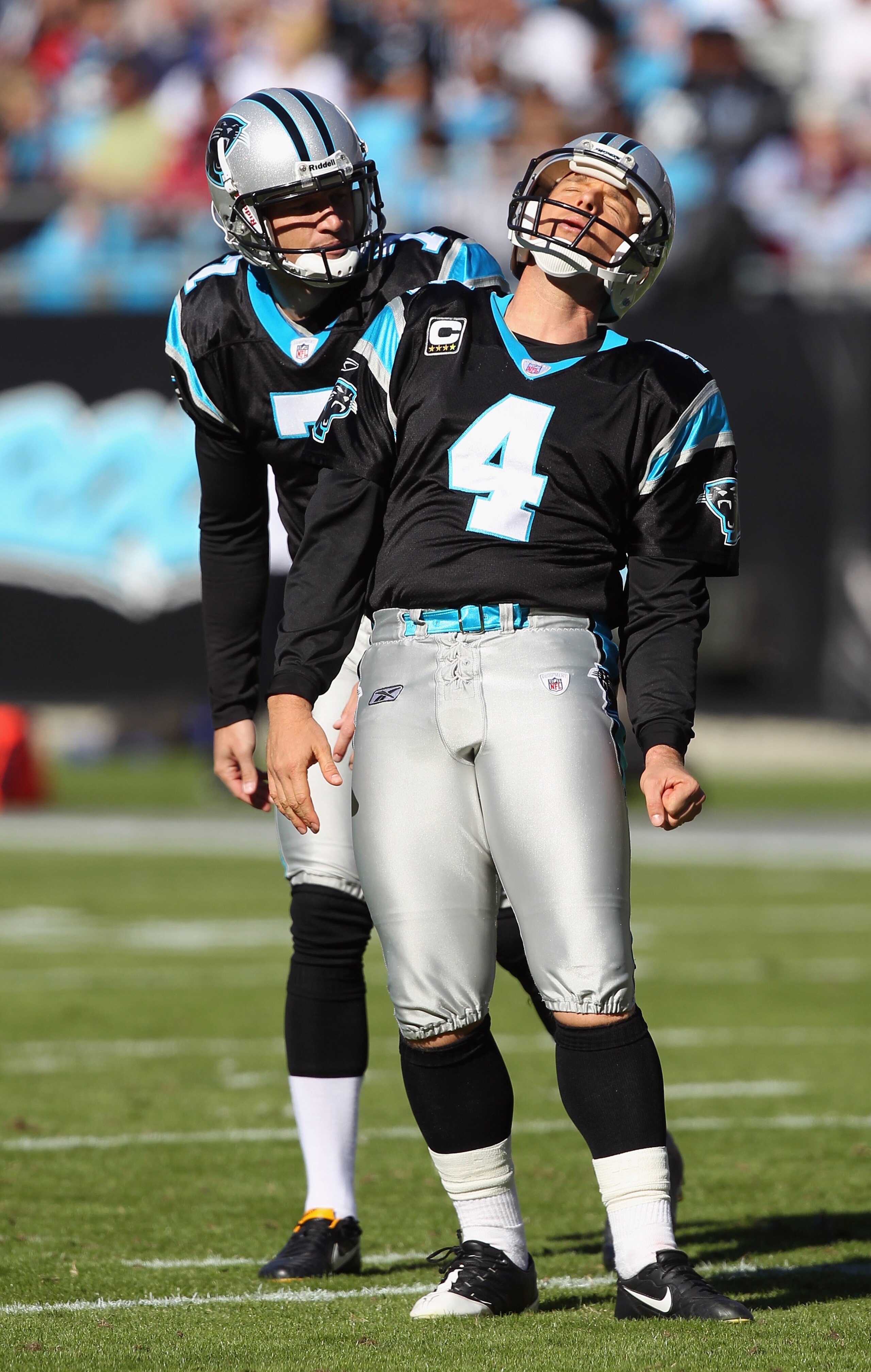 CHARLOTTE, NC - NOVEMBER 07:  Teammates Jason Baker #7 and John Kasay #4 of the Carolina Panthers react to a missed field goal against the New Orleans Saints during their game at Bank of America Stadium on November 7, 2010 in Charlotte, North Carolina.  (