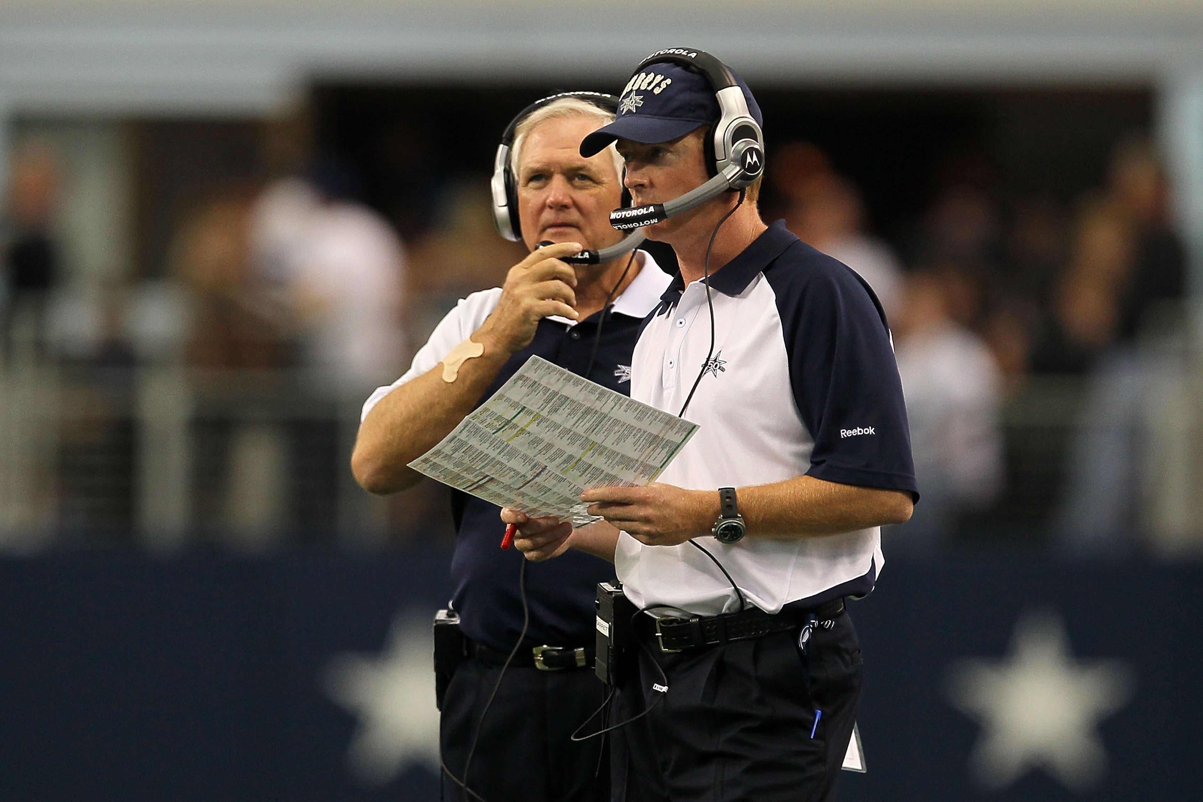 ARLINGTON, TX - OCTOBER 31:  (L-R) Head coach Wade Phillips and assistant head coach/offensive coordinator Jason Garrett of the Dallas Cowboys looks on against the Jacksonville Jaguars at Cowboys Stadium on October 31, 2010 in Arlington, Texas.  (Photo by