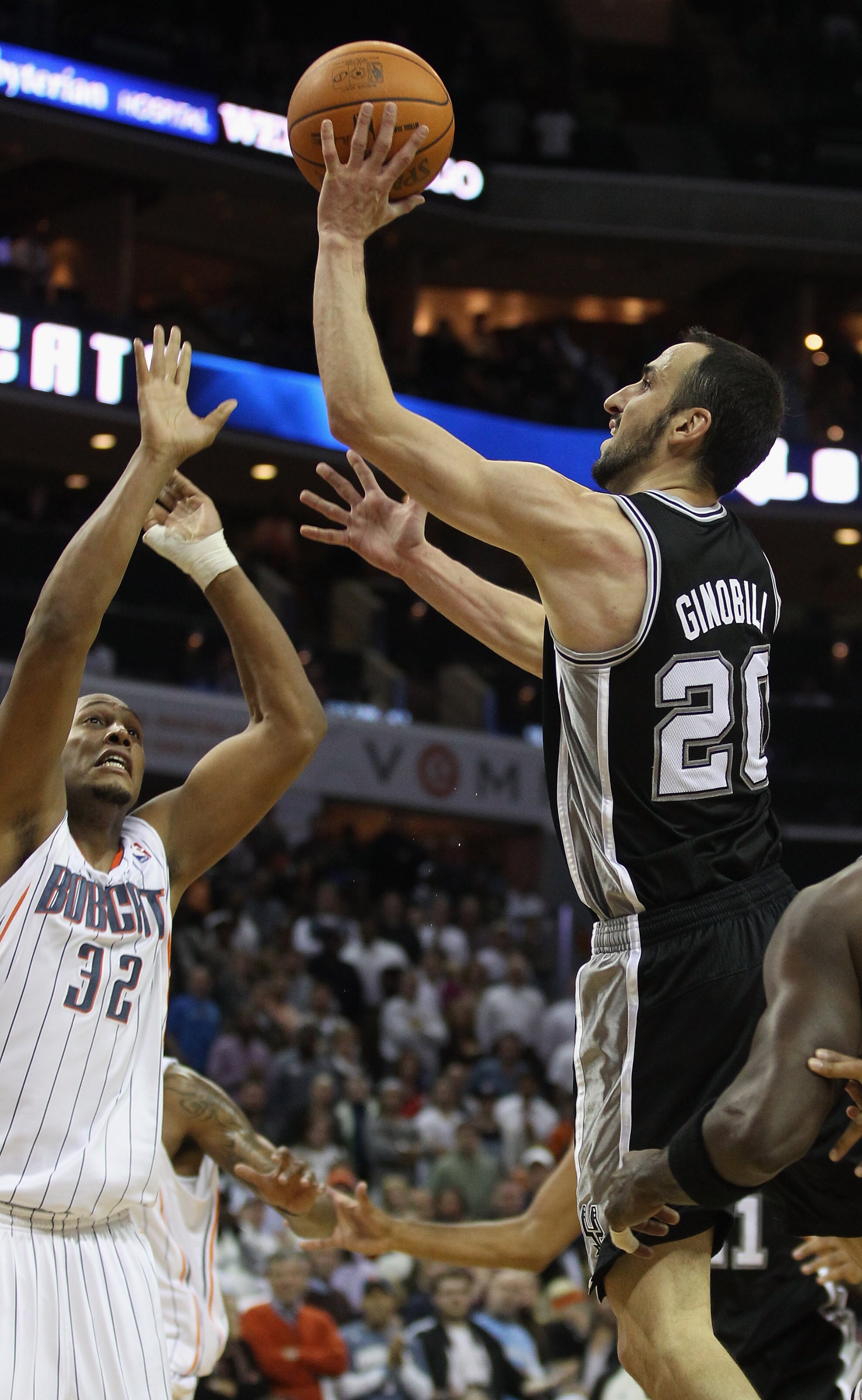 CHARLOTTE, NC - NOVEMBER 08:  Manu Ginobili #20 of the San Antonio Spurs makes a basket late in the 4th quarter giving the Spurs a 95-91 victory over the Charlotte Bobcats during their game at Time Warner Cable Arena on November 8, 2010 in Charlotte, Nort