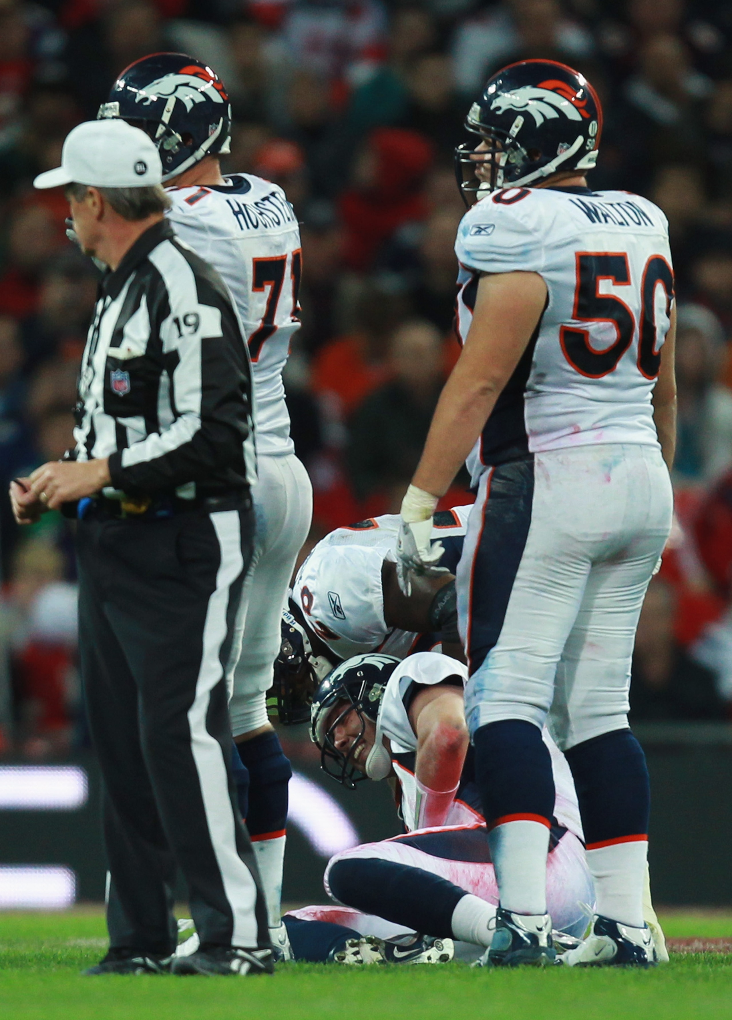 LONDON, ENGLAND - OCTOBER 31:  Kyle Orton #8 of Denver Broncos is injured following a tackle during the NFL International Series match between Denver Broncos and San Francisco 49ers at Wembley Stadium on October 31, 2010 in London, England. This is the fo